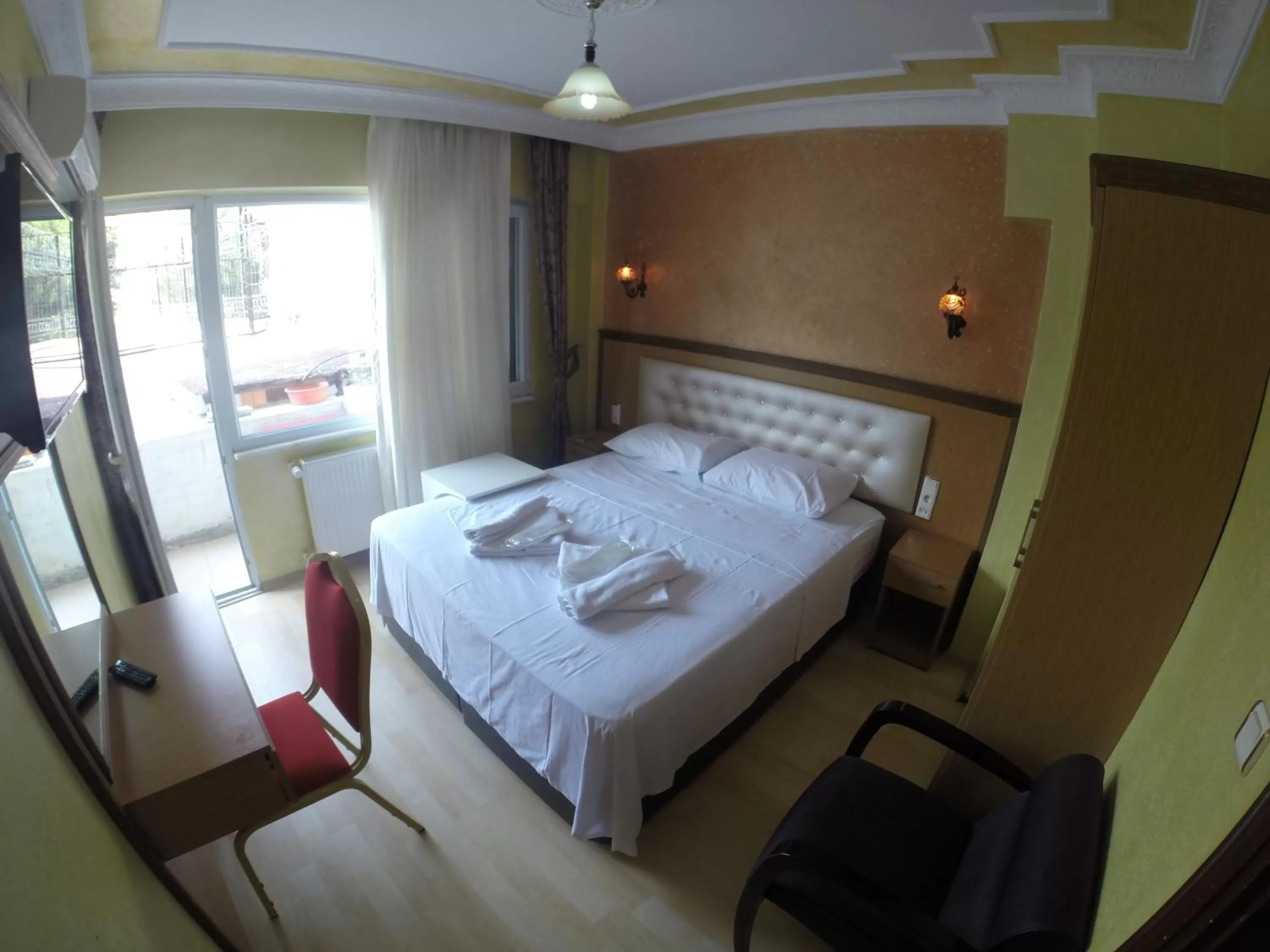 Seating area, Bed in Arat Apartments