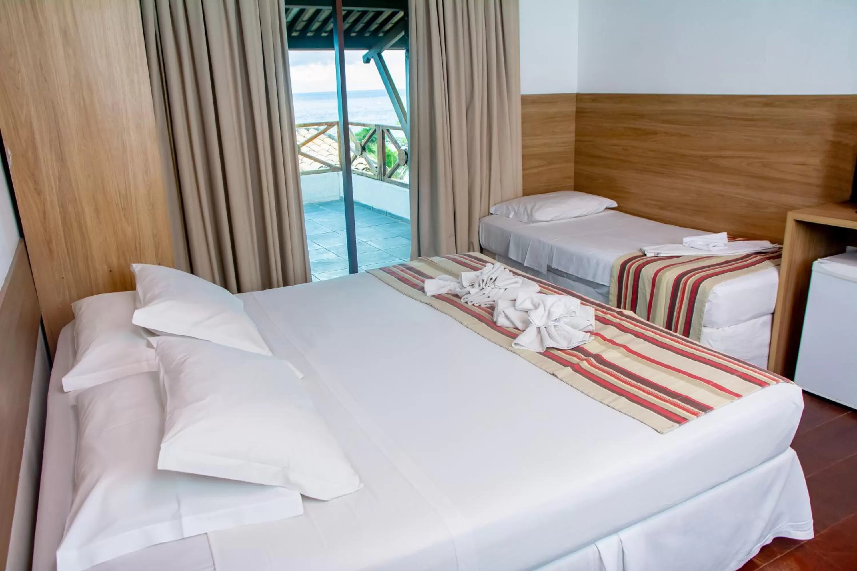 Bed in La Belle Beach Hotel