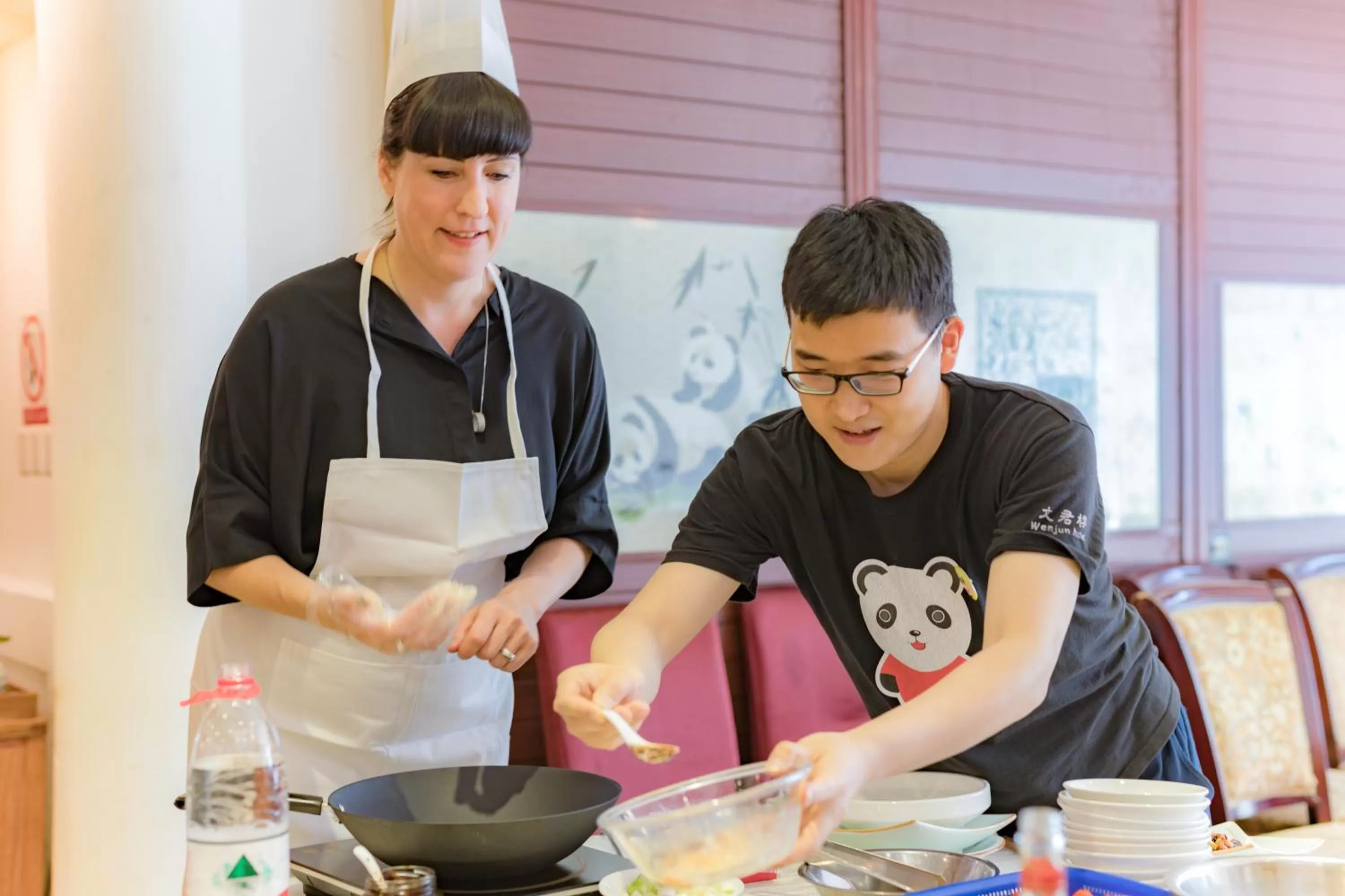 Staff in Wenjun Courtyard Hotel---3mins walk from Tonghuimen metro station ,next to People`s Park, fluent English service ,travel agency