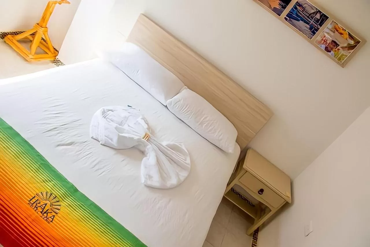 Bed in Hotel Iraka Zenu