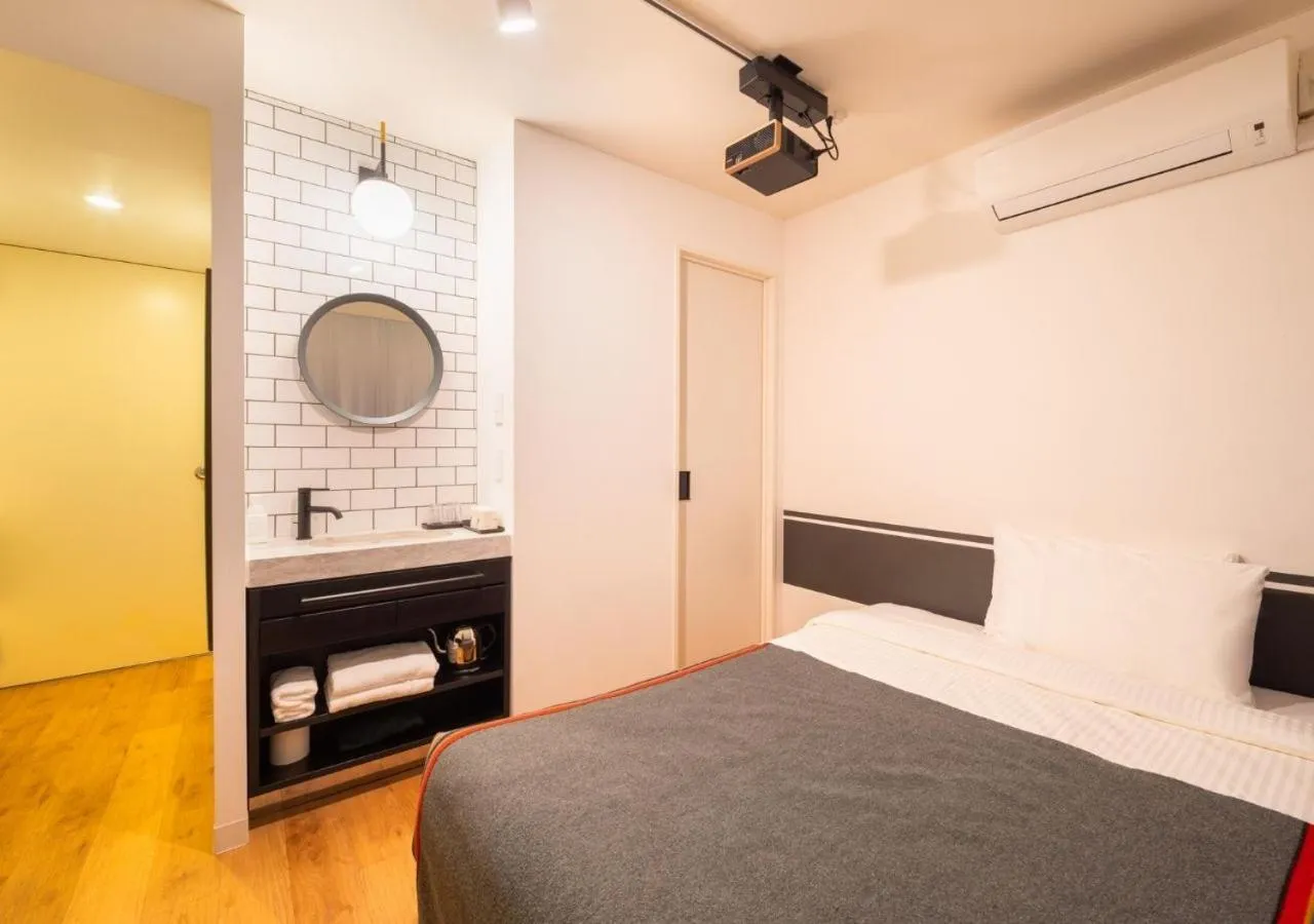 Bed in Hotel Graphy Nezu