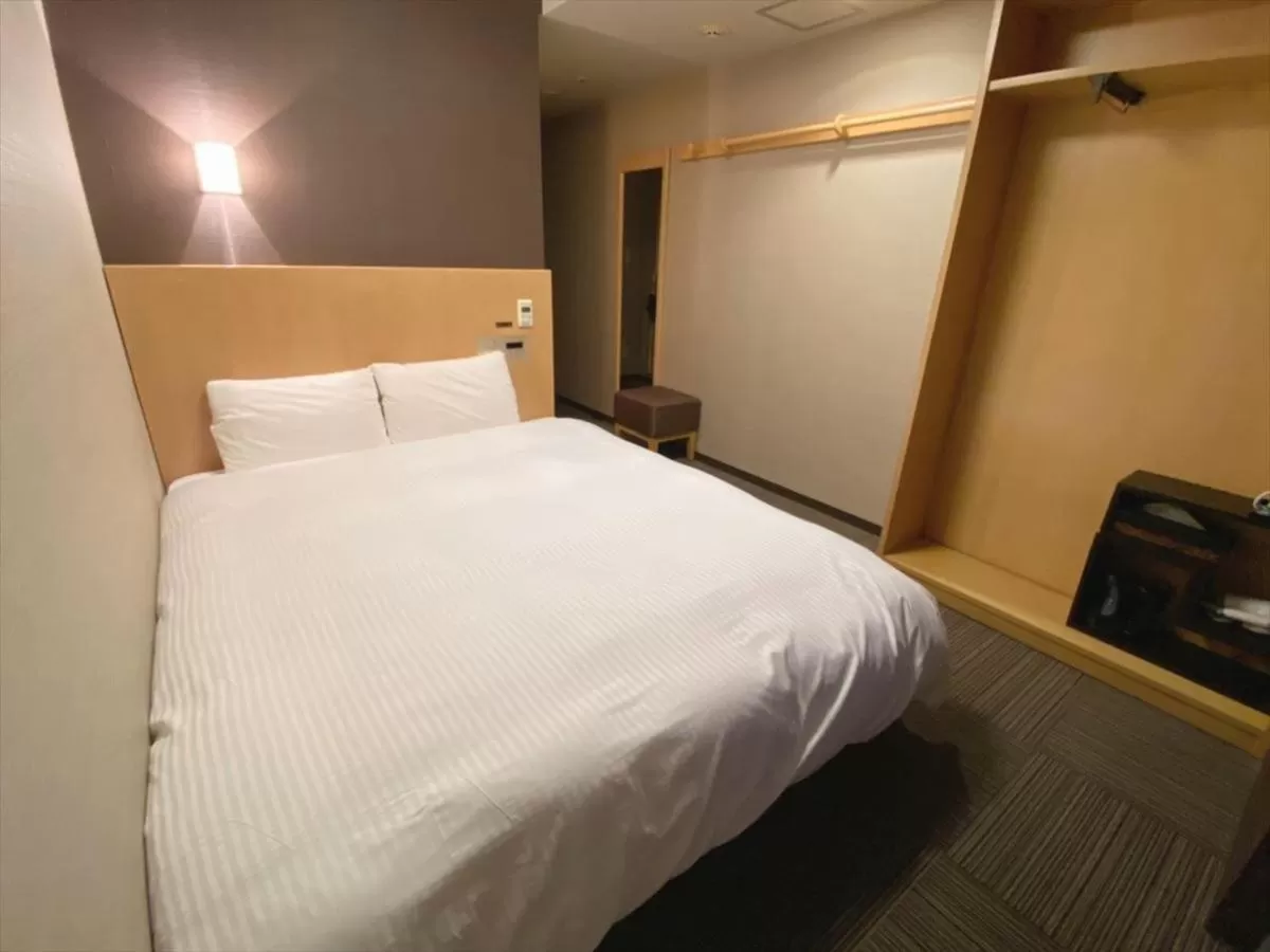 Bed in Dormy Inn Hiroshima