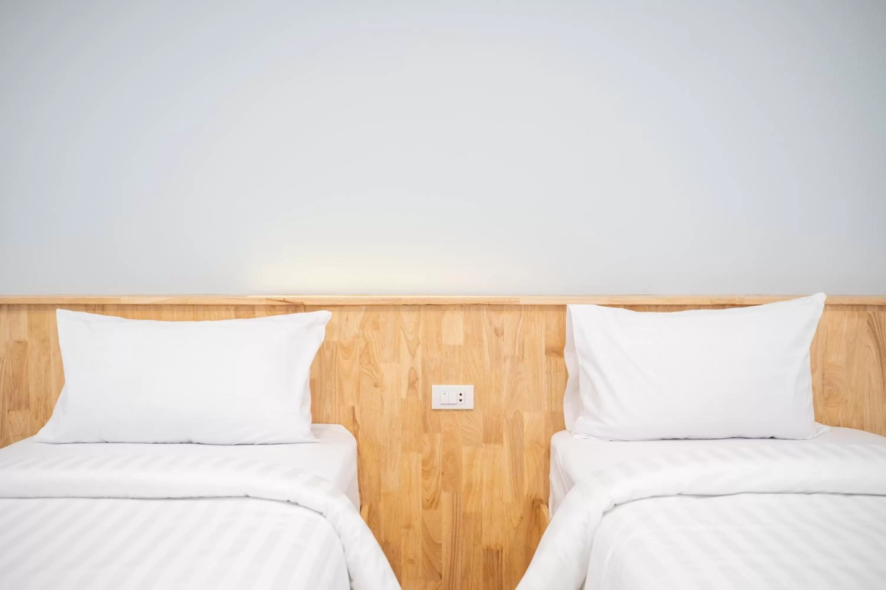 Bed in Meesuk ChiangRai Hotel, SHA Certified