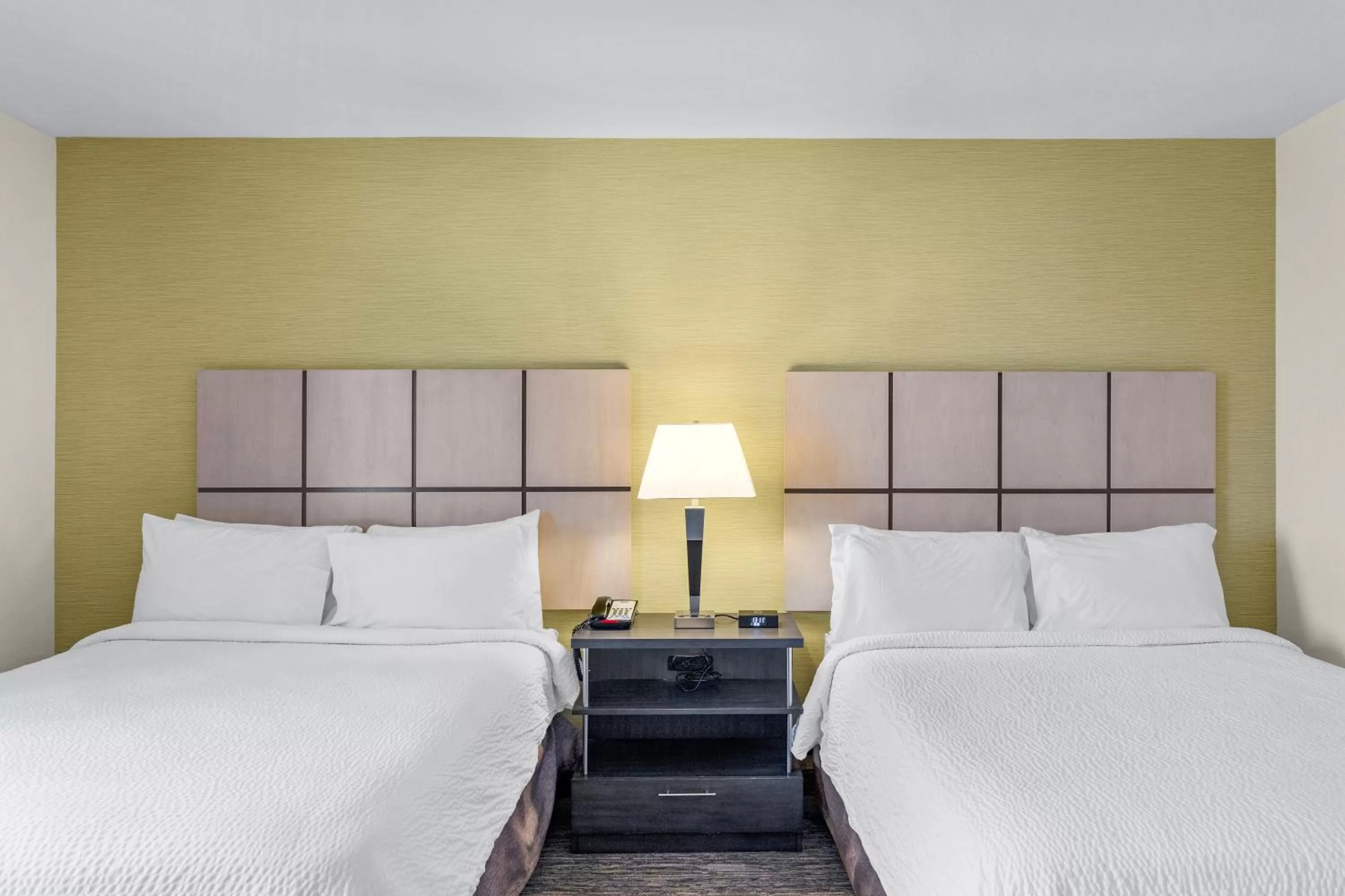 Bed in Candlewood Suites Erie by IHG