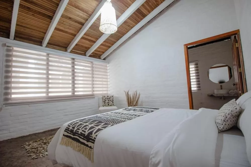 Bed in Rústic Hotel Quinta La Aurora