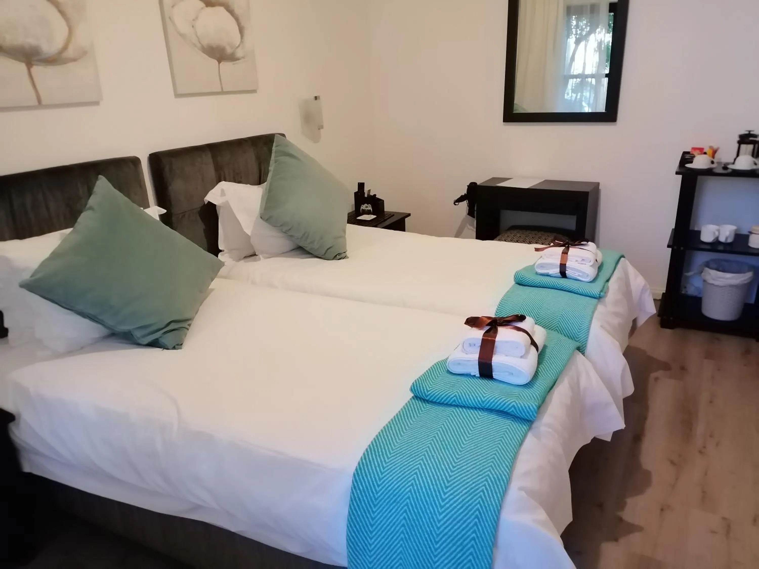 Bed in Point B Guest House -Sustainable Solar Energy