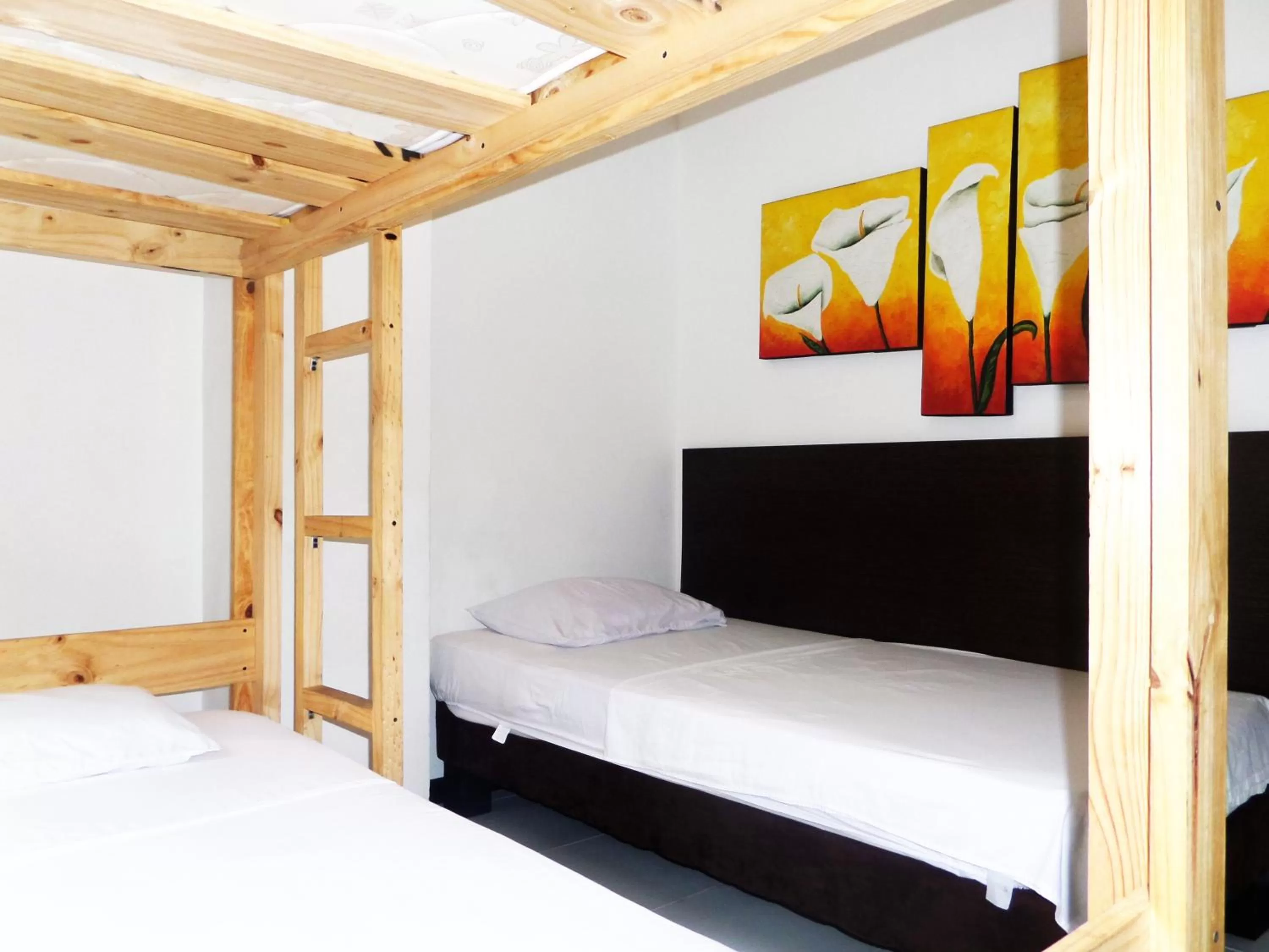 Bed in Apartasuites San Marcos