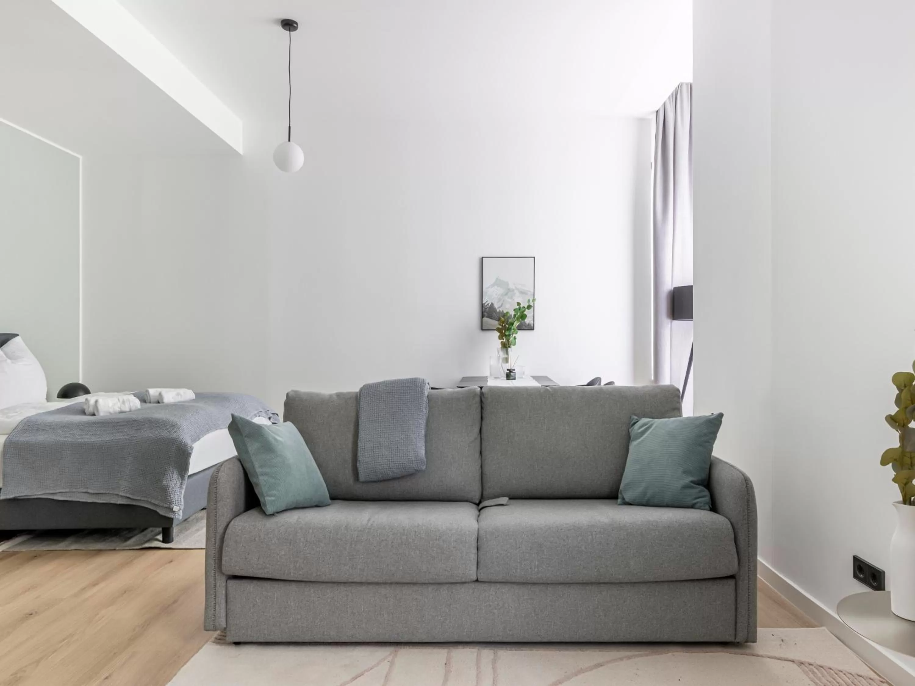 Seating area, Bed in Limehome Rosenheim Gillitzerstraße