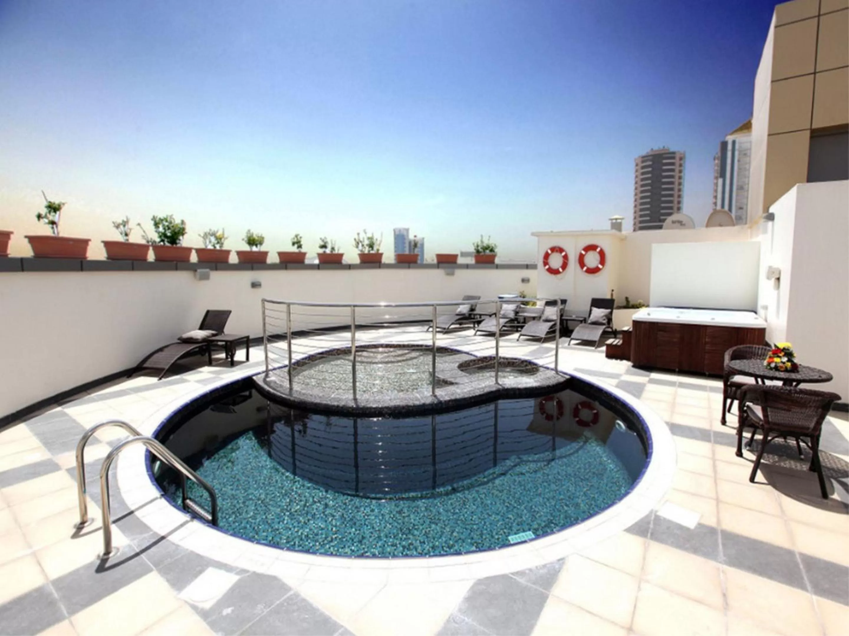 Swimming pool in Xclusive Maples Hotel Apartment