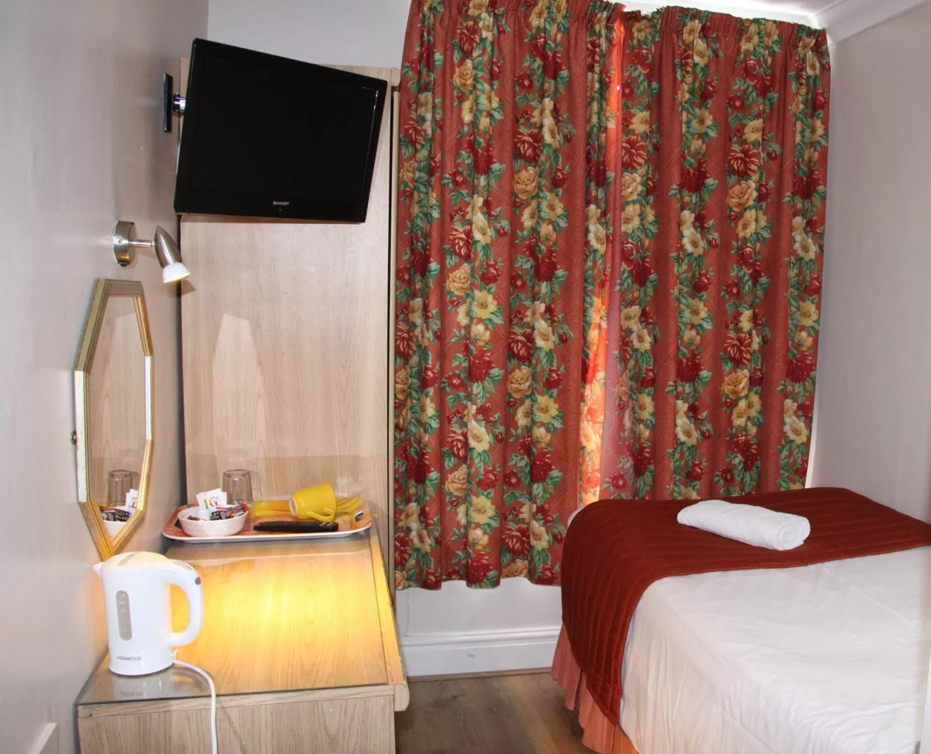 Bed in Ambassador Hotel