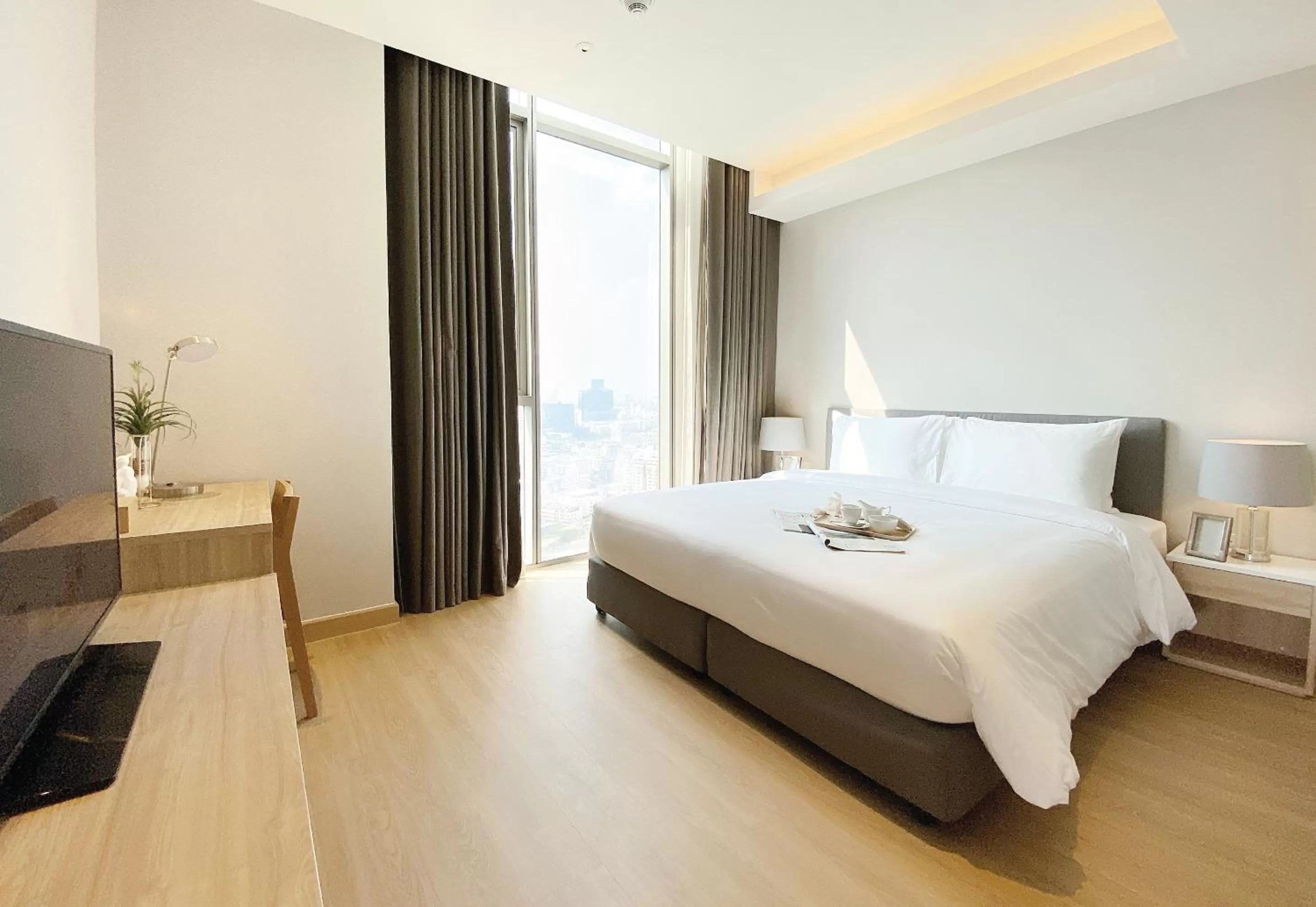 Bed in Oakwood Suites Bangkok