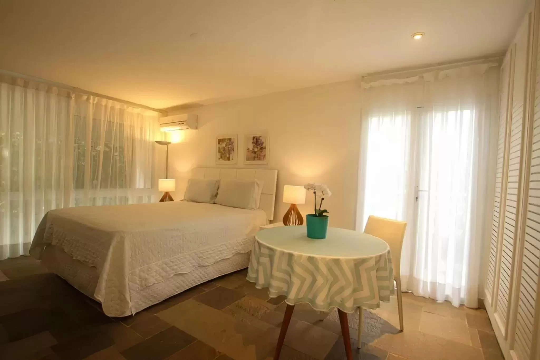 Bed in Guest House Guarujá