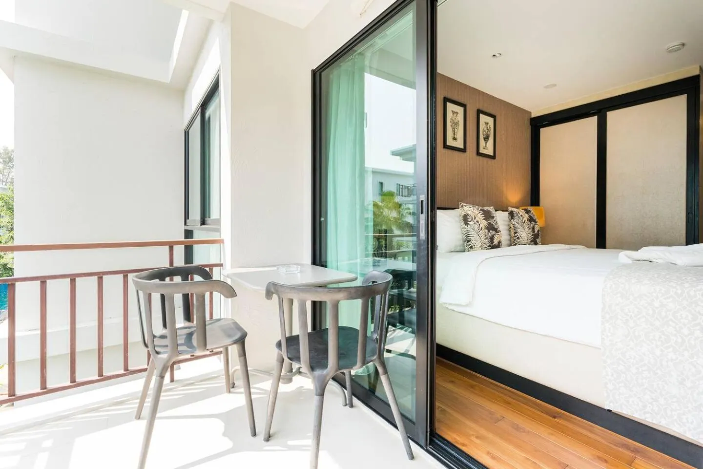 Balcony/Terrace, Bed in The Title KR Beach Condotel Rawai Beach