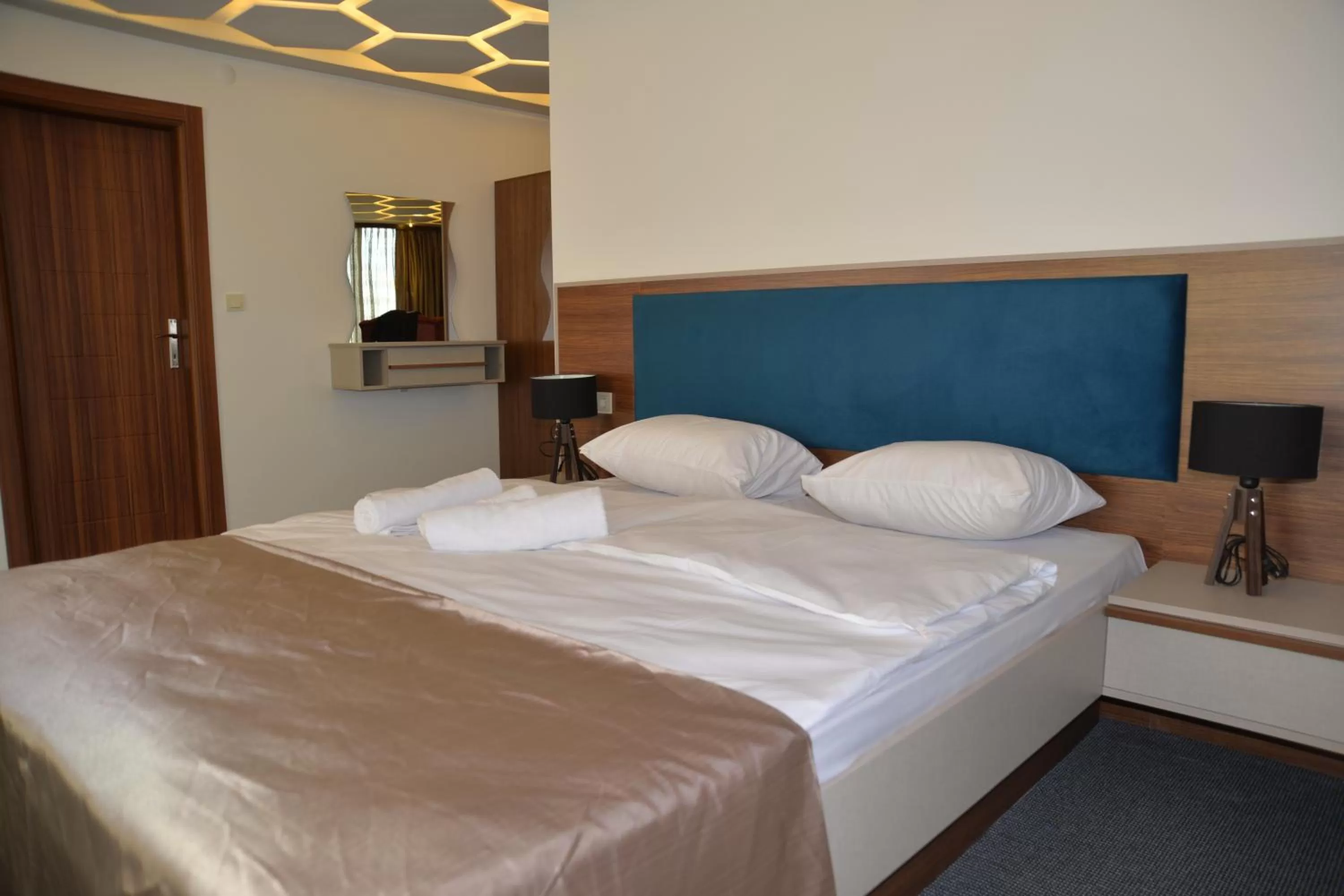 Bed in TEVETOGLU HOTEL