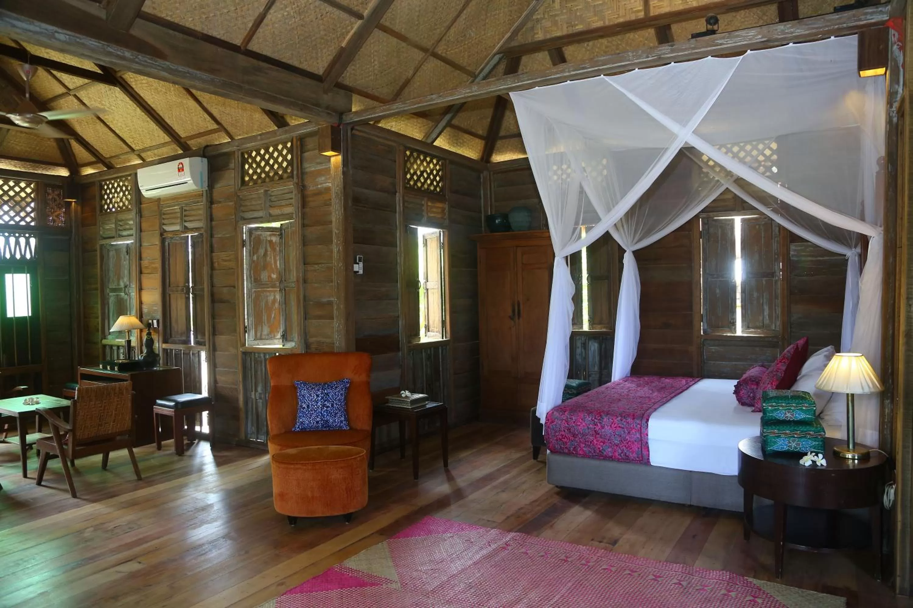 Bed in Kunang Kunang Heritage Villas