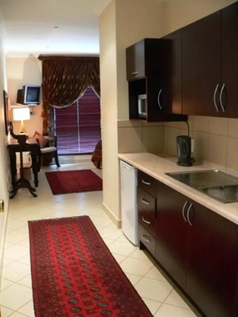 Kitchen or kitchenette in Rustenburg Boutique Hotel