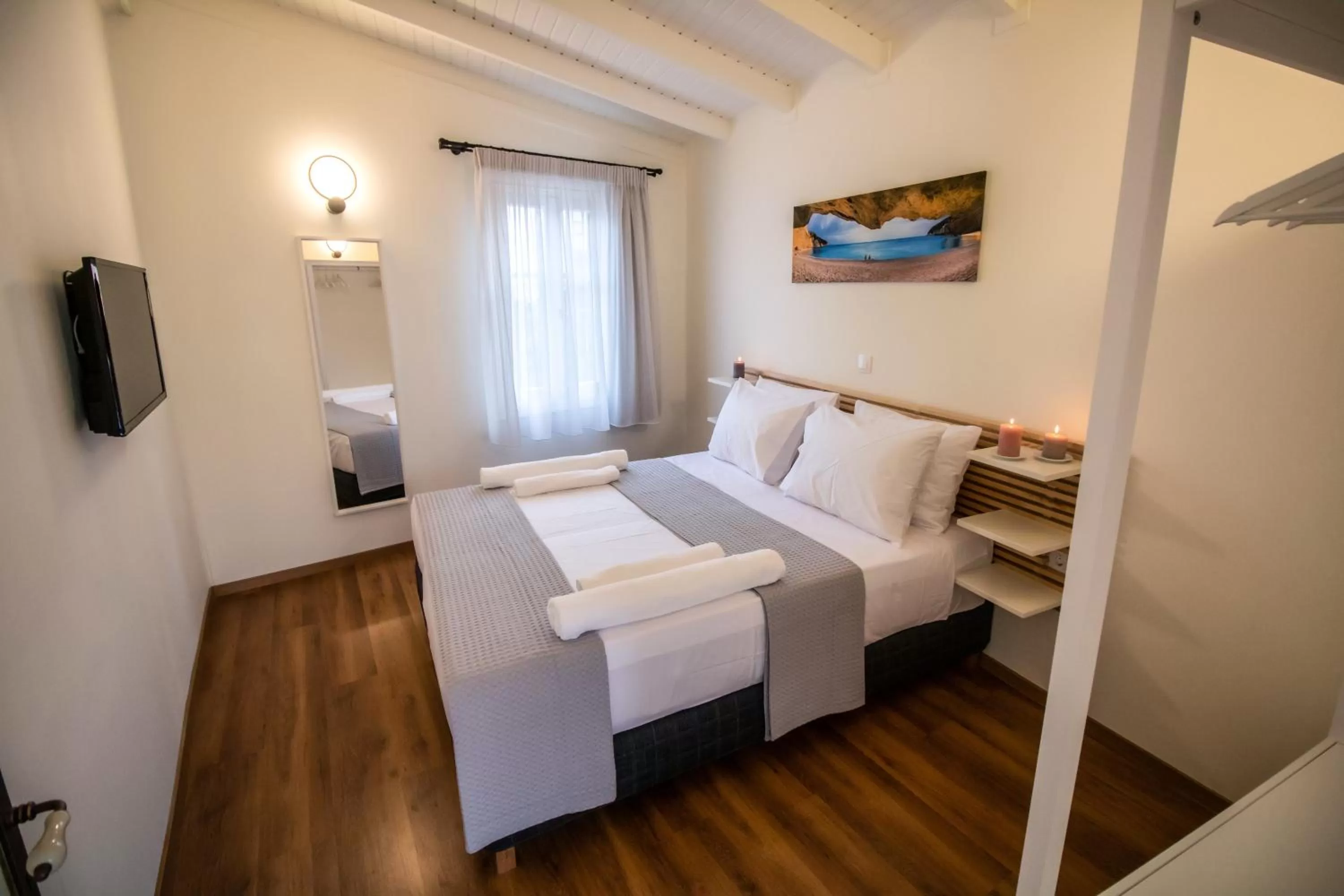 Bed in Levkosh Apartments at Lefkada's Heart