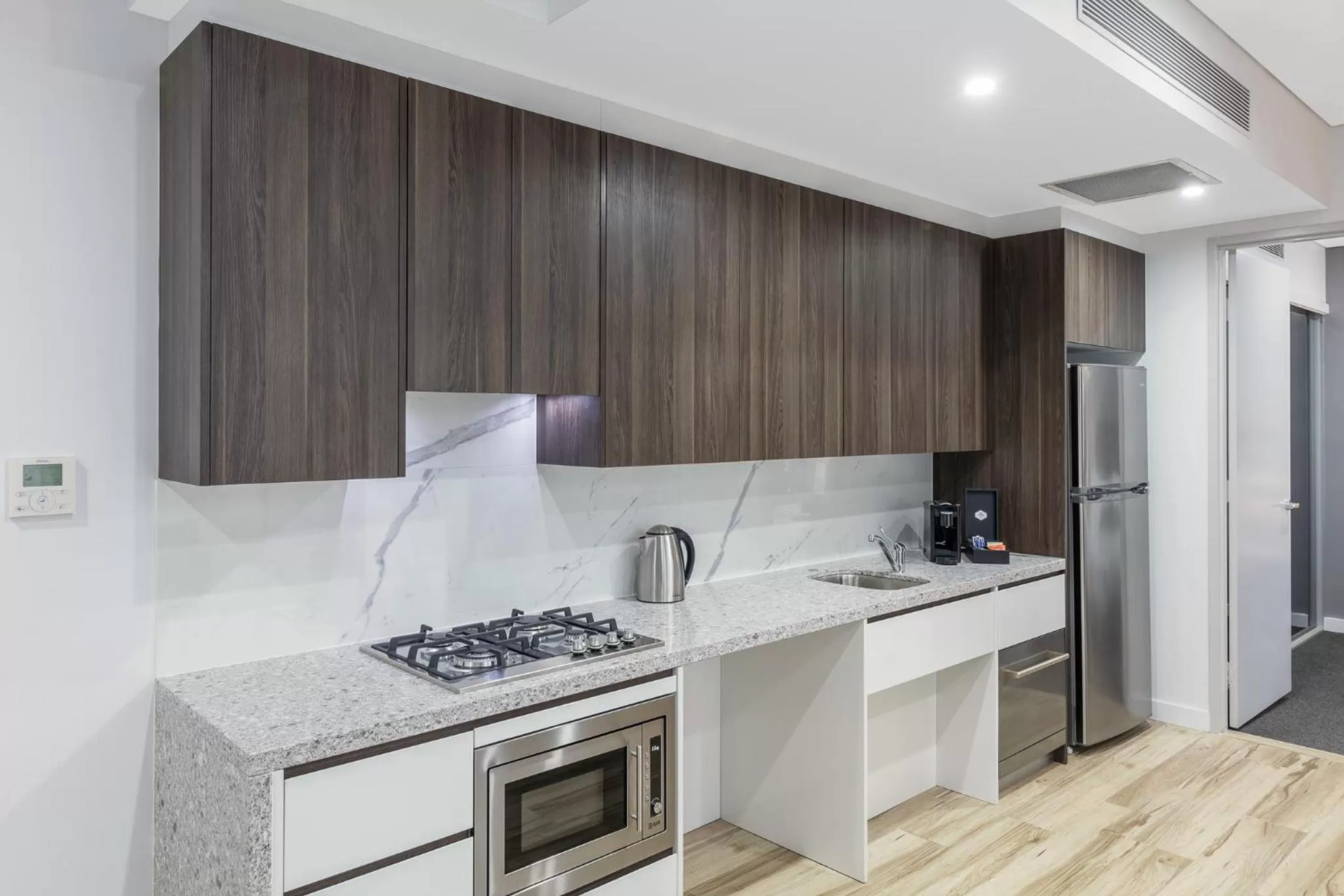 Kitchen or kitchenette in Meriton Suites Church Street, Parramatta