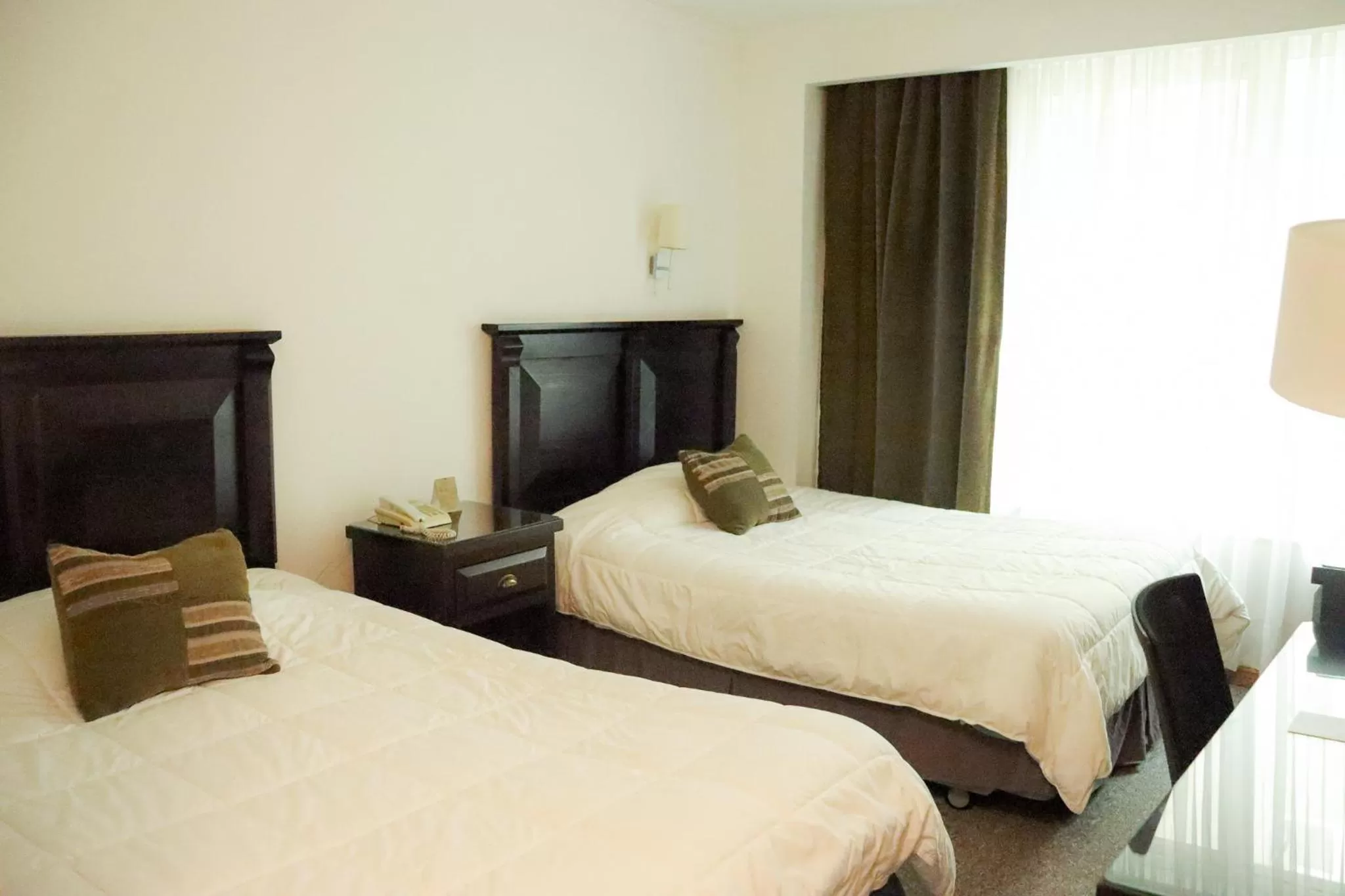 Bed in Hotel Terrano Concepción