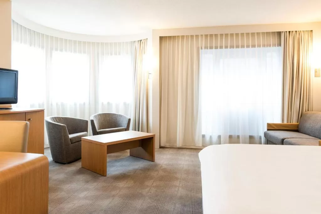 Living room, Bed in Novotel Gent Centrum