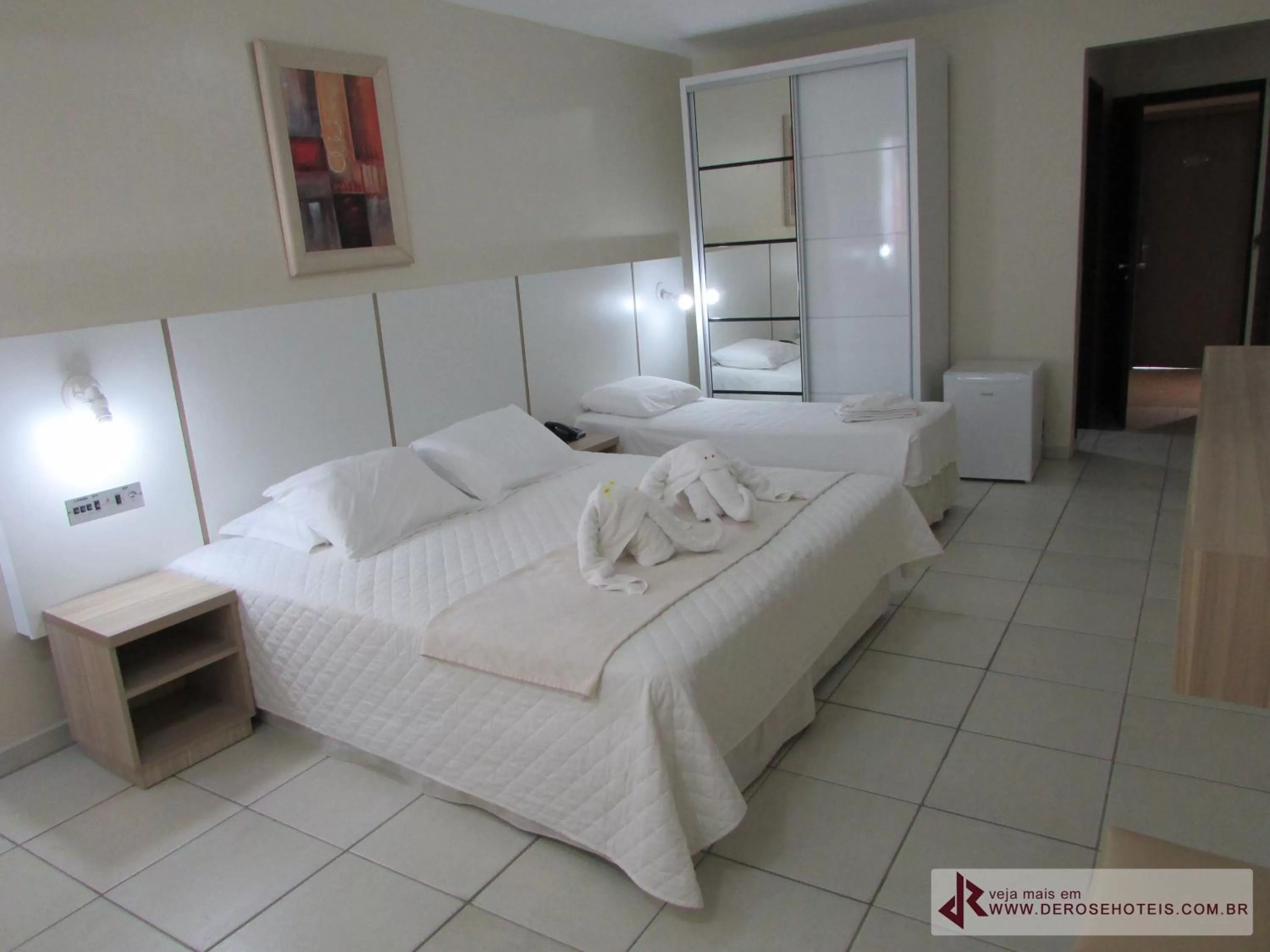 Bed in De Rose Palace Hotel