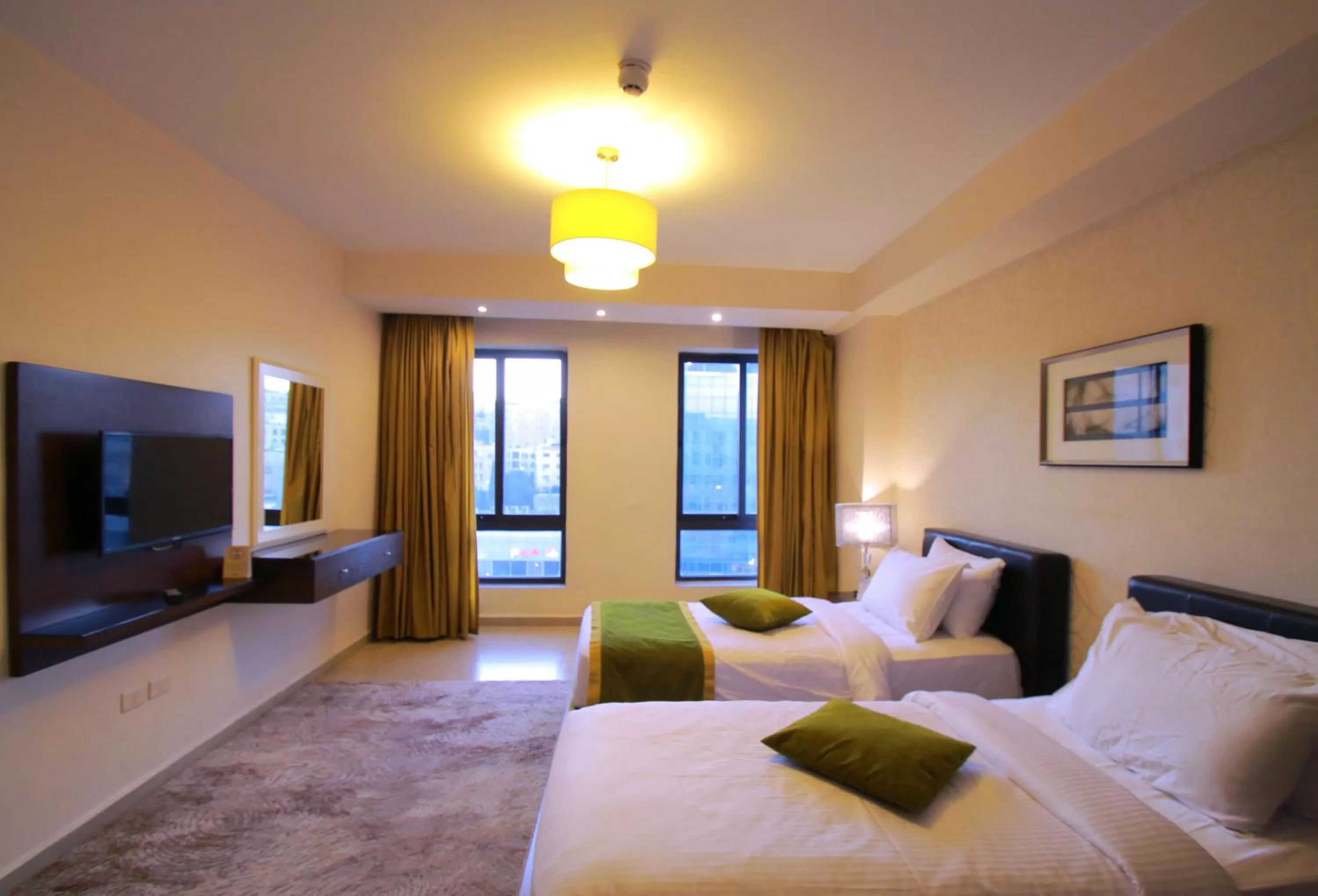 Bed in City Rose Hotel Suites