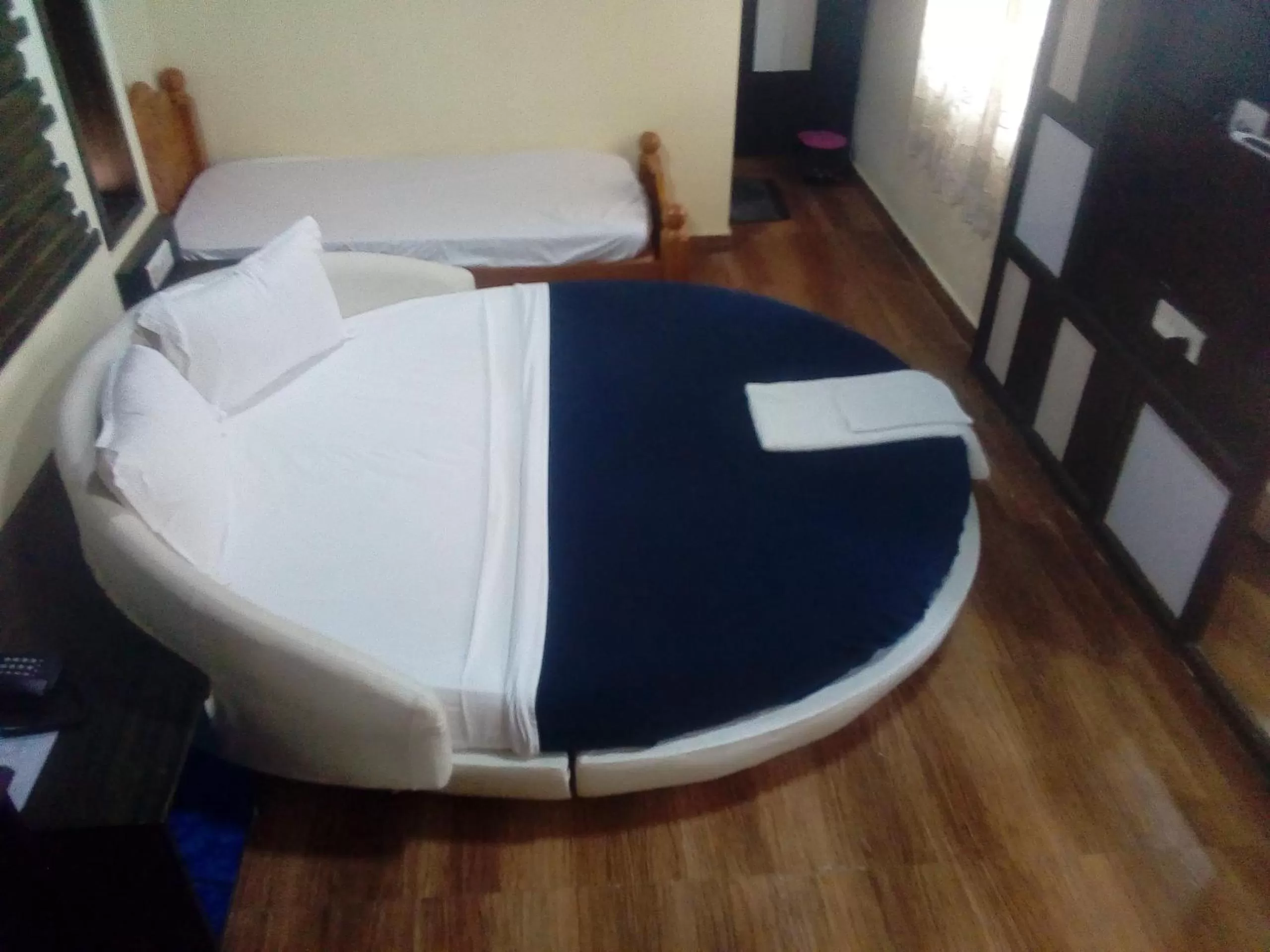 Photo of the whole room, Bed in Hotel Anandhiram Heritage