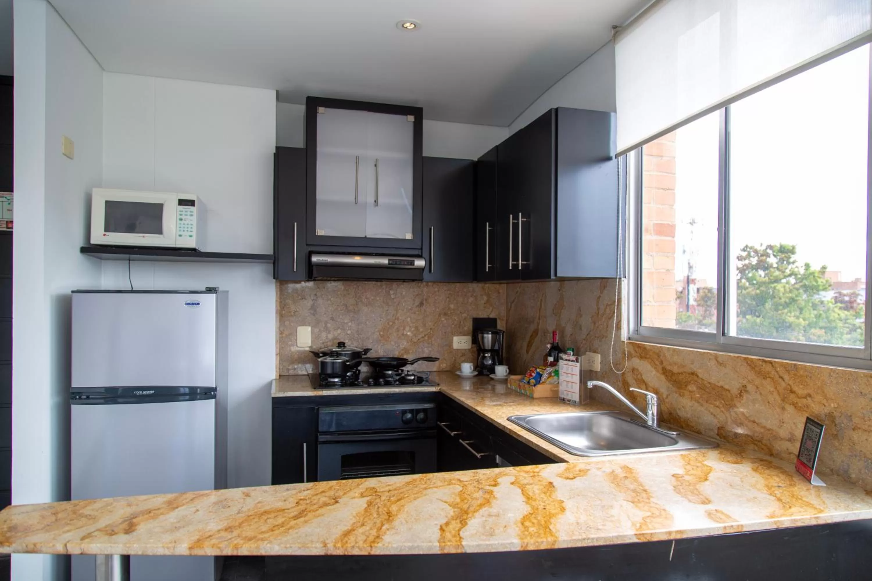 Kitchen or kitchenette in Hotel 104 Art Suites