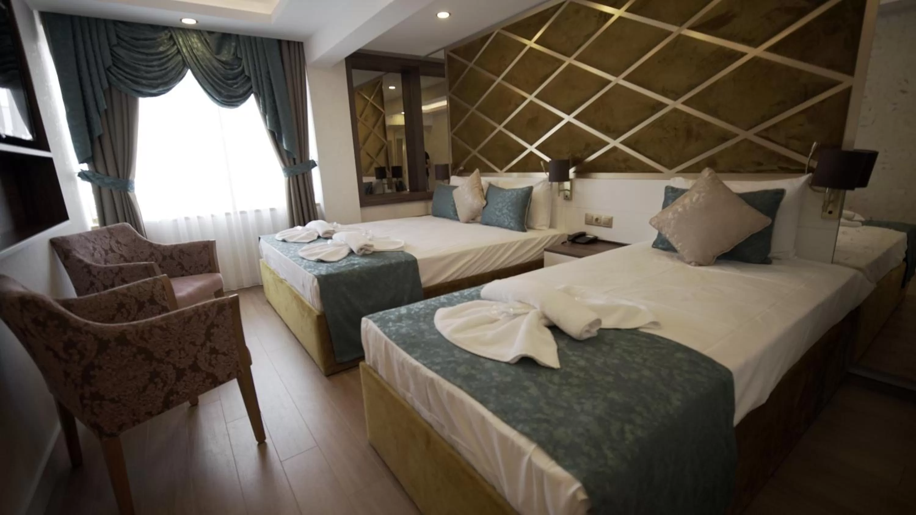 Photo of the whole room, Bed in Burj Al Istanbul