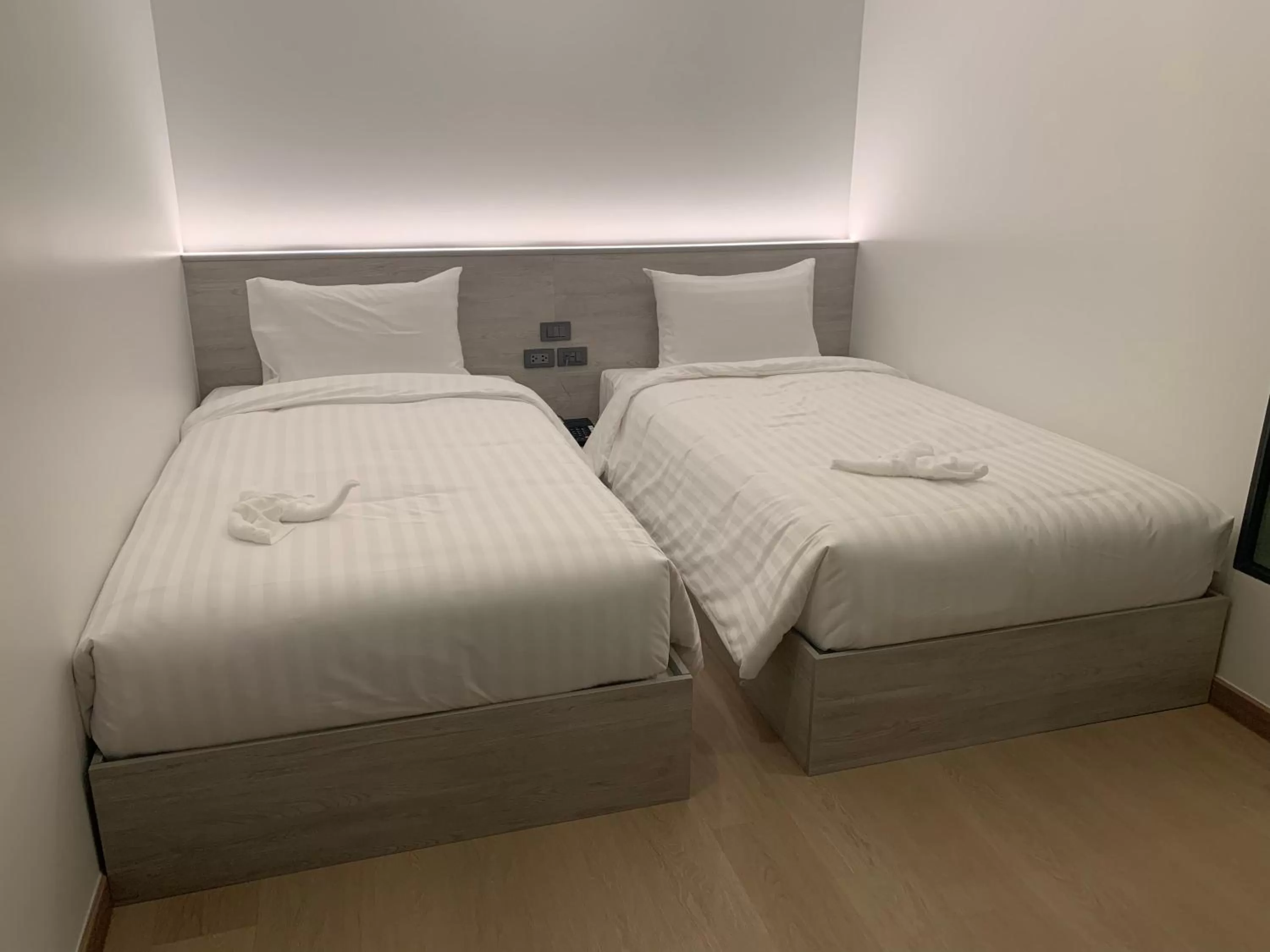 Bed in Thana Wisut Hotel