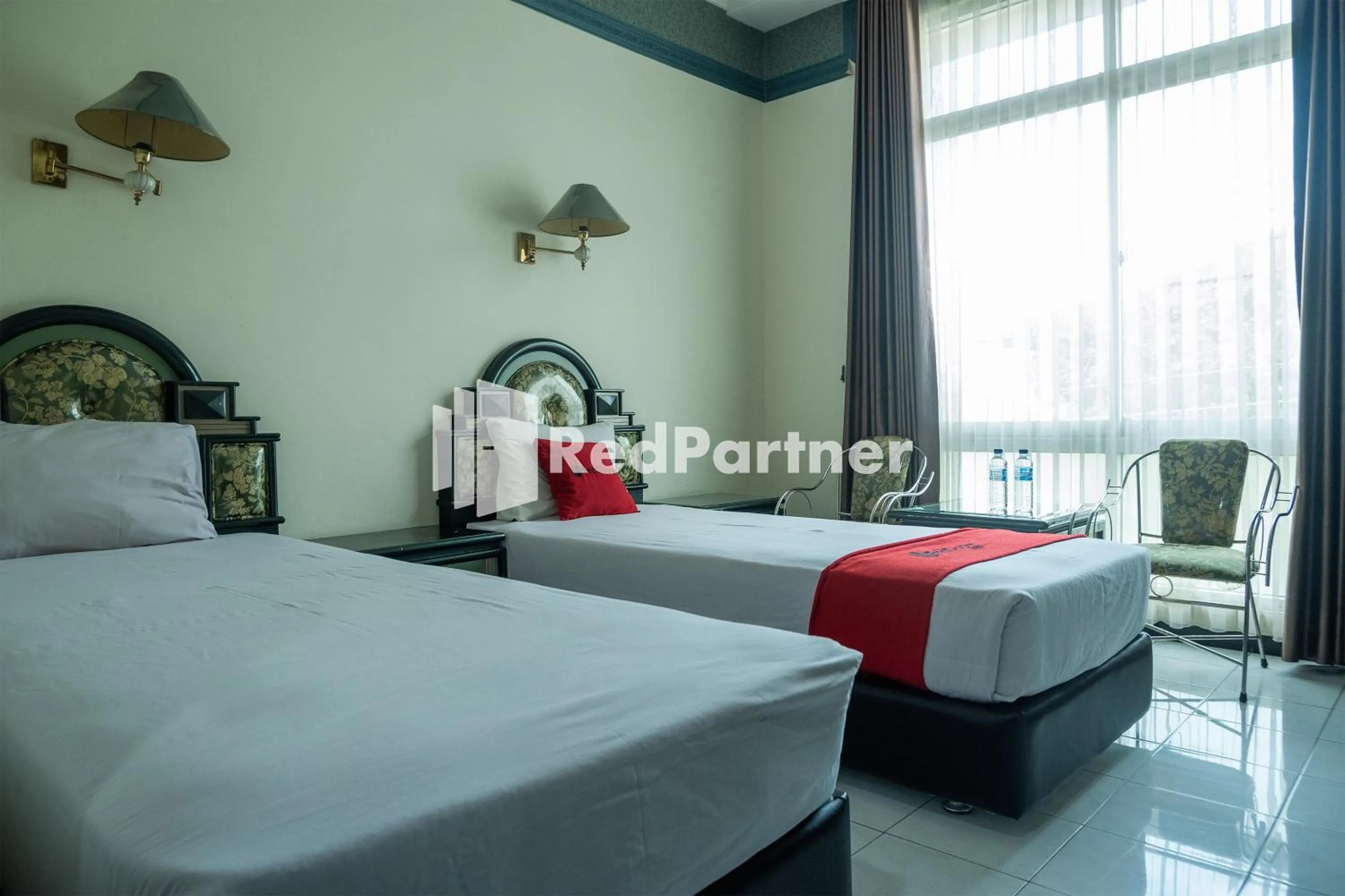 Bed in Akur Hotel Malioboro Mitra RedDoorz