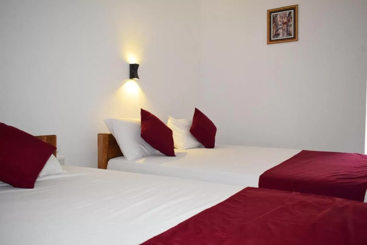 Bed in Hotel Theevanni Inn