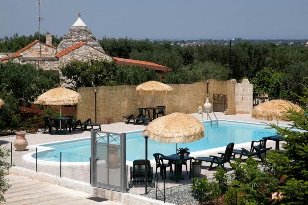 Swimming pool in L'Isola Felice e Trulli Sotto Le Stelle