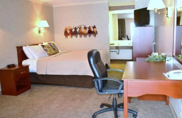 Bed in Covered Wagon Motel Lusk WY