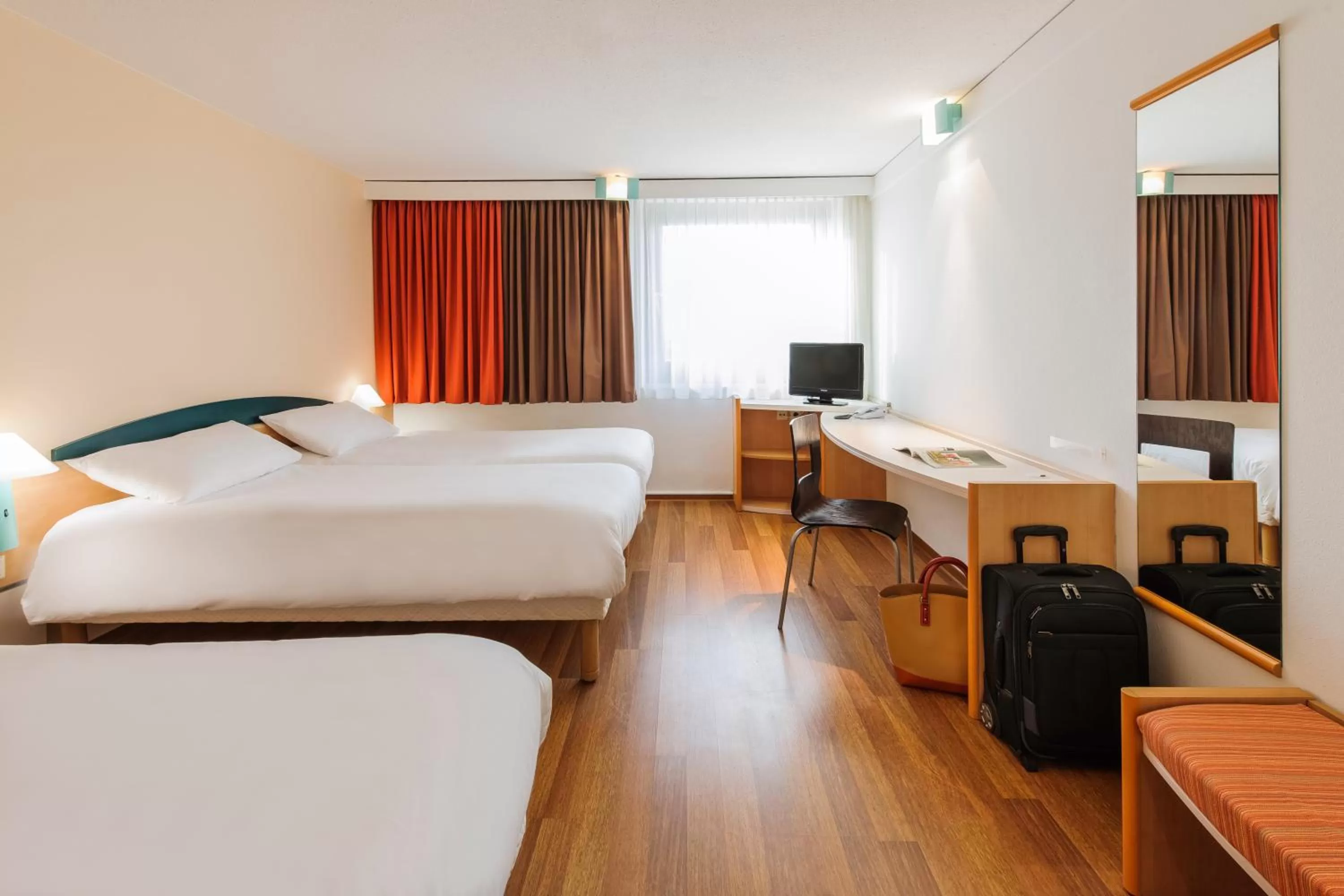Photo of the whole room, Bed in ibis Berlin Messe
