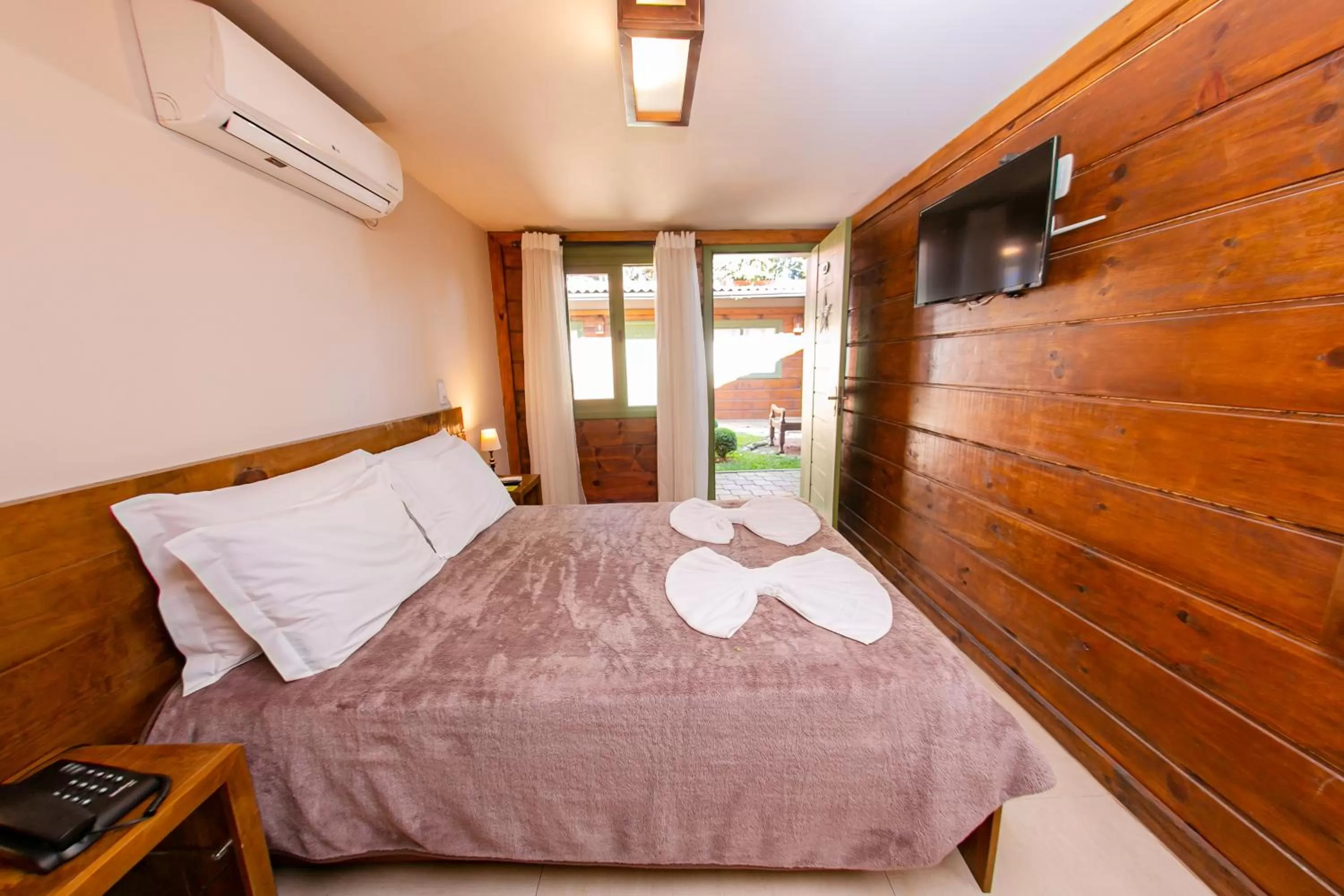 Bed in Pousada Charm Canela