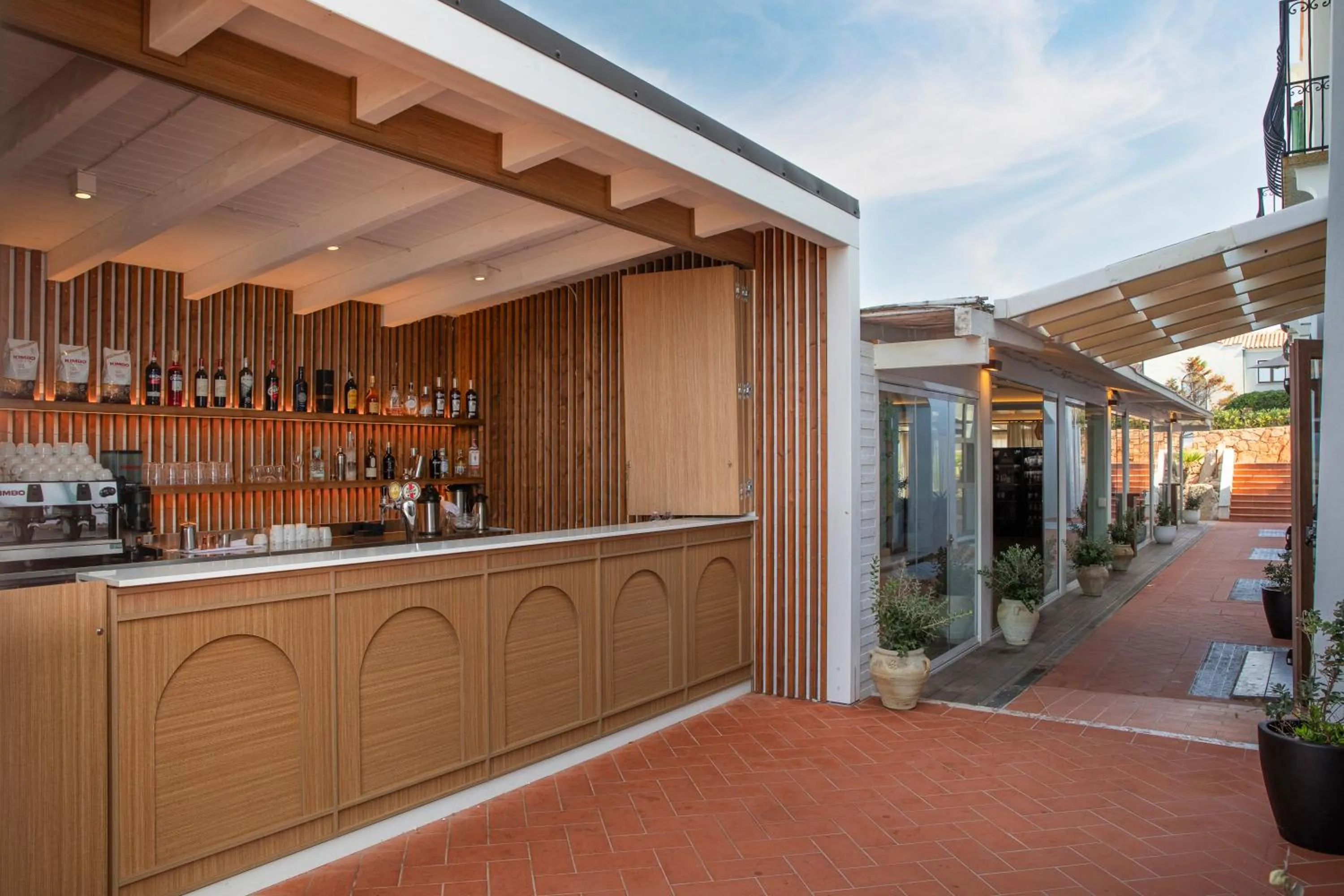 Lounge or bar in Mangia's Santa Teresa Sardinia, Curio Collection by Hilton