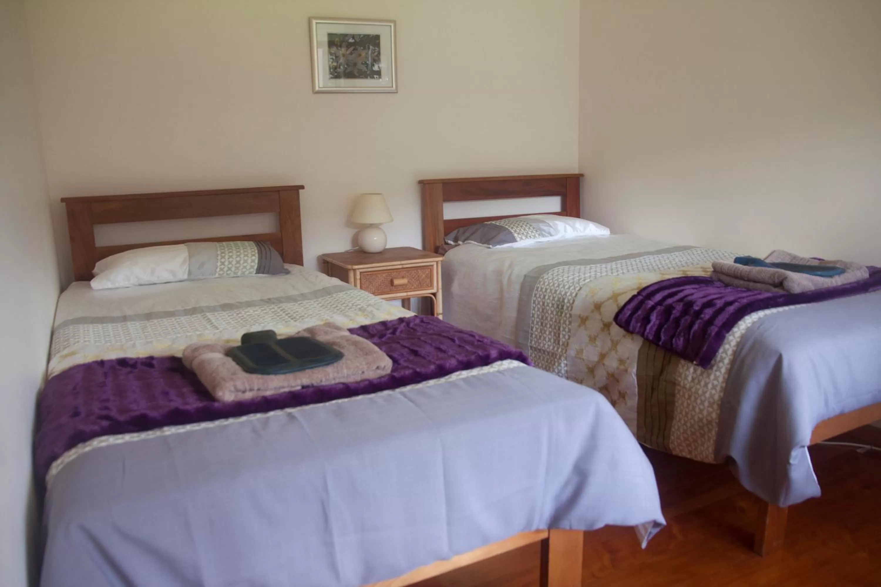 Bed in Kawai Purapura Yoga Retreat Centre