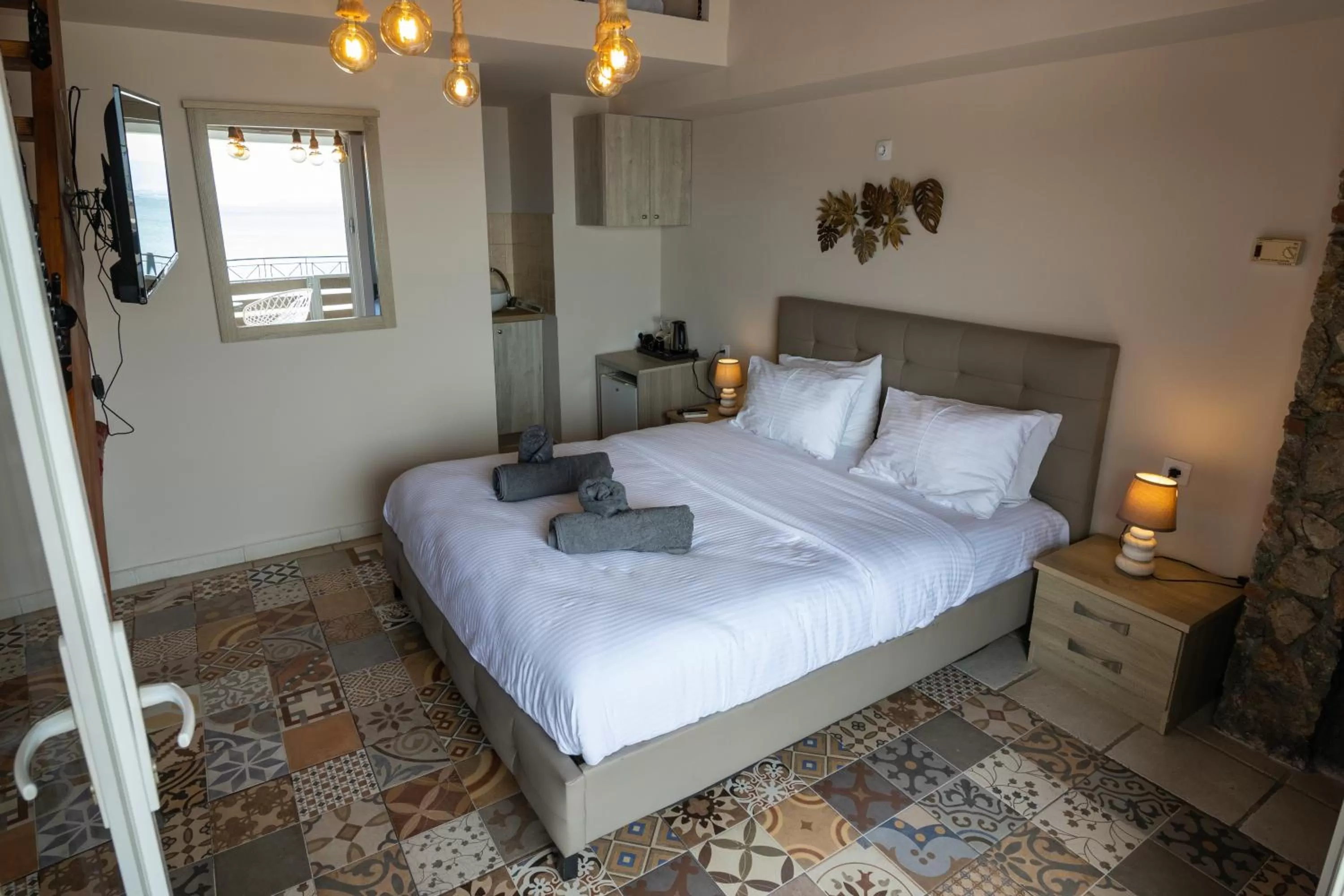 Bed in Votsalakia Hotel & Luxury Apartments