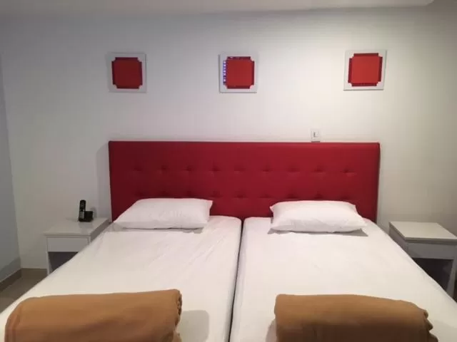 Bed in Hotel Garden City Boutique
