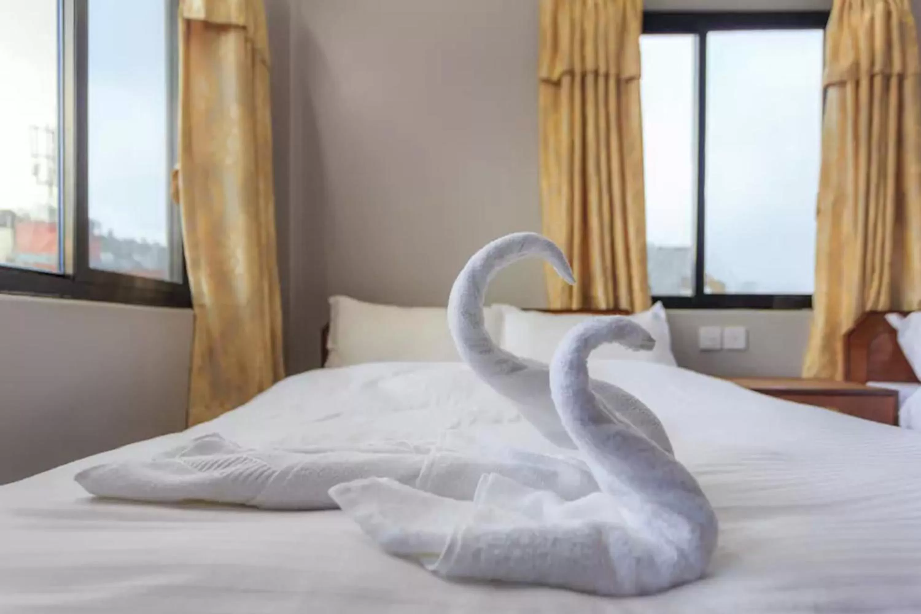 Bed in Hotel Immortal Inn