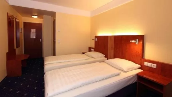 Bed in Aparthotel Astro - Nichtraucherhotel