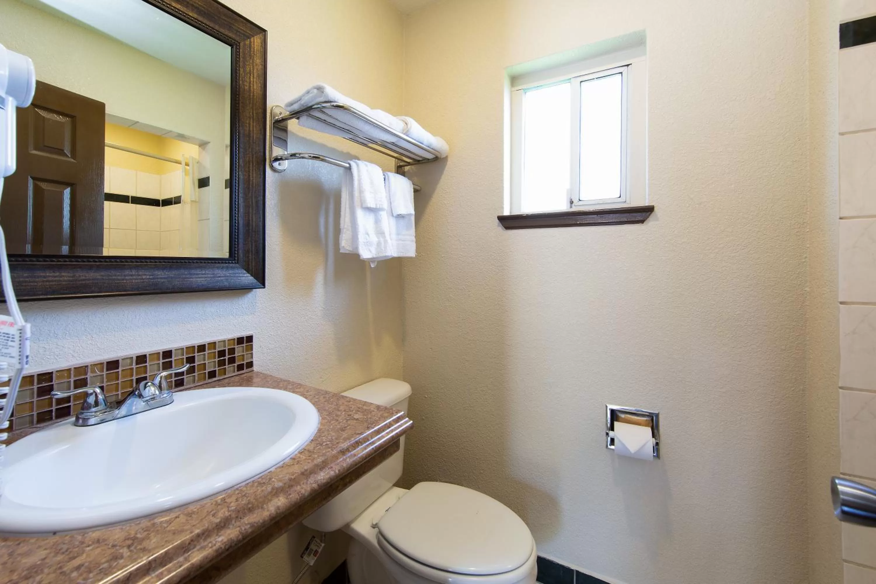 Bathroom in Travel Lodge by Wyndham Merced Yosemite