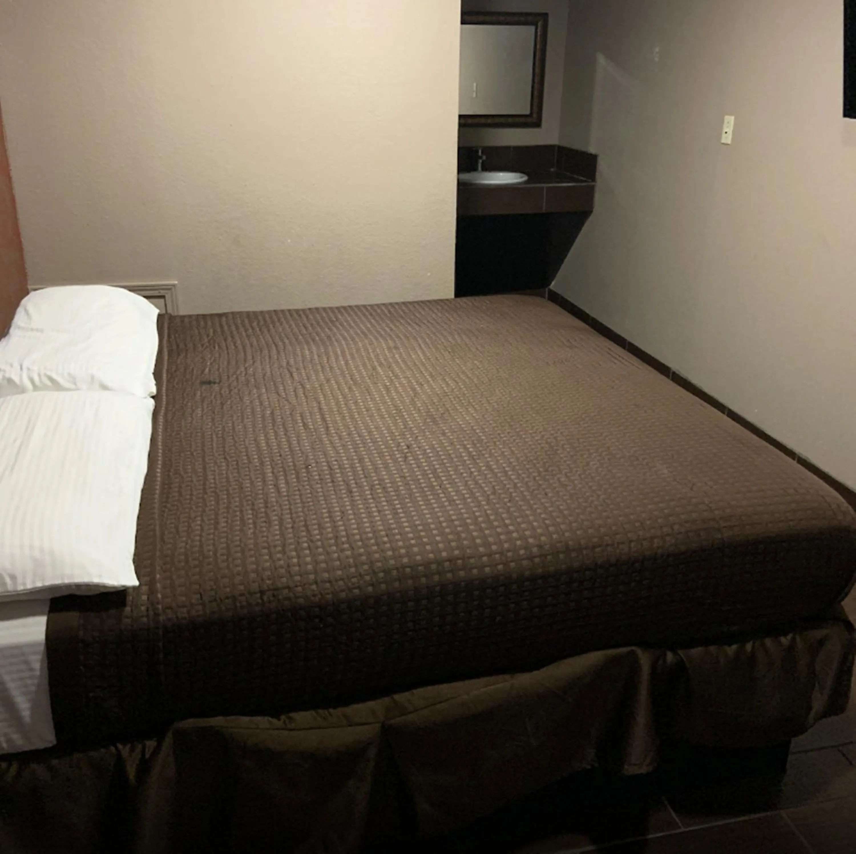 Bed in Royal Relax Inn