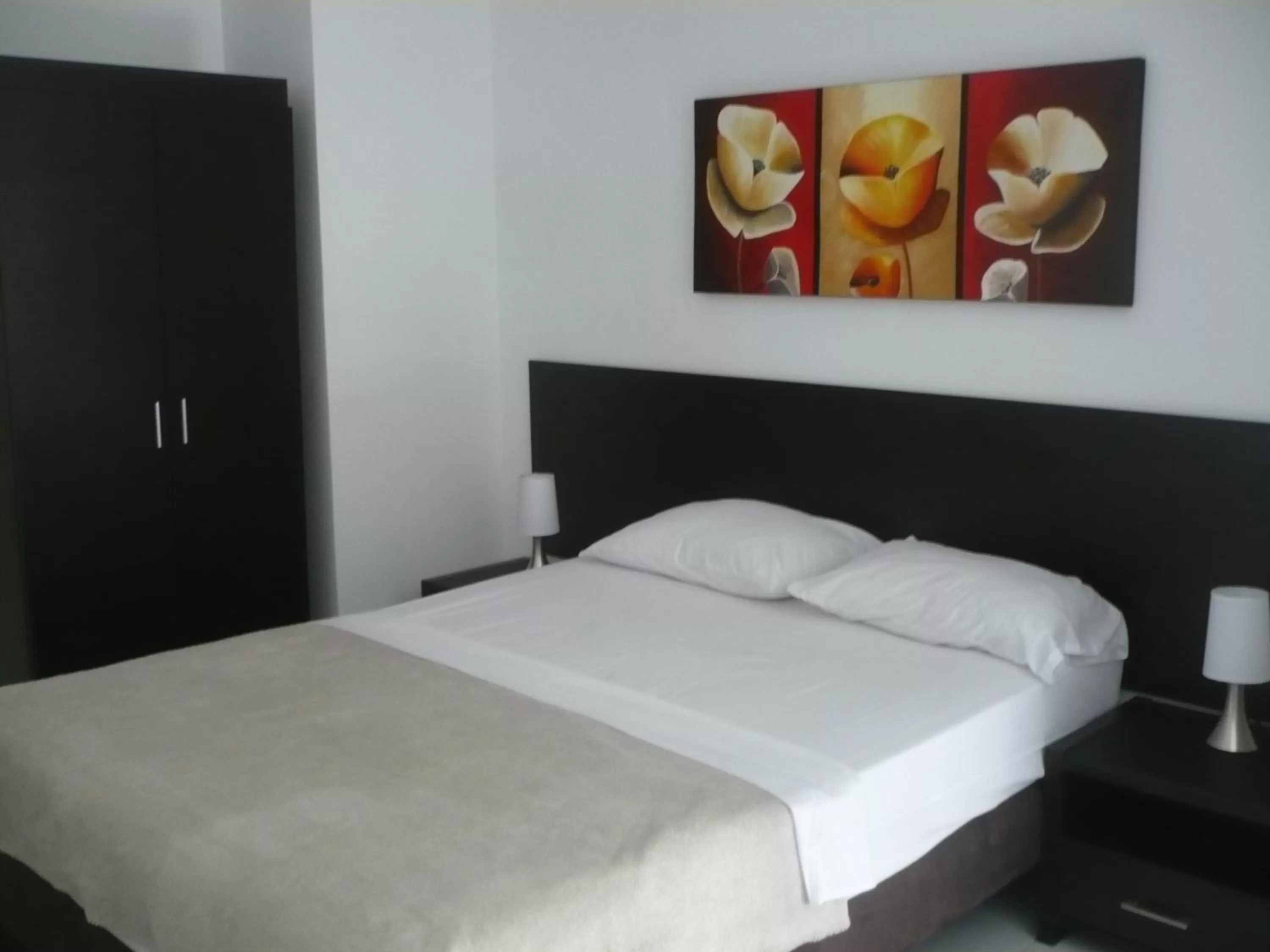 Bed in Apartasuites San Marcos