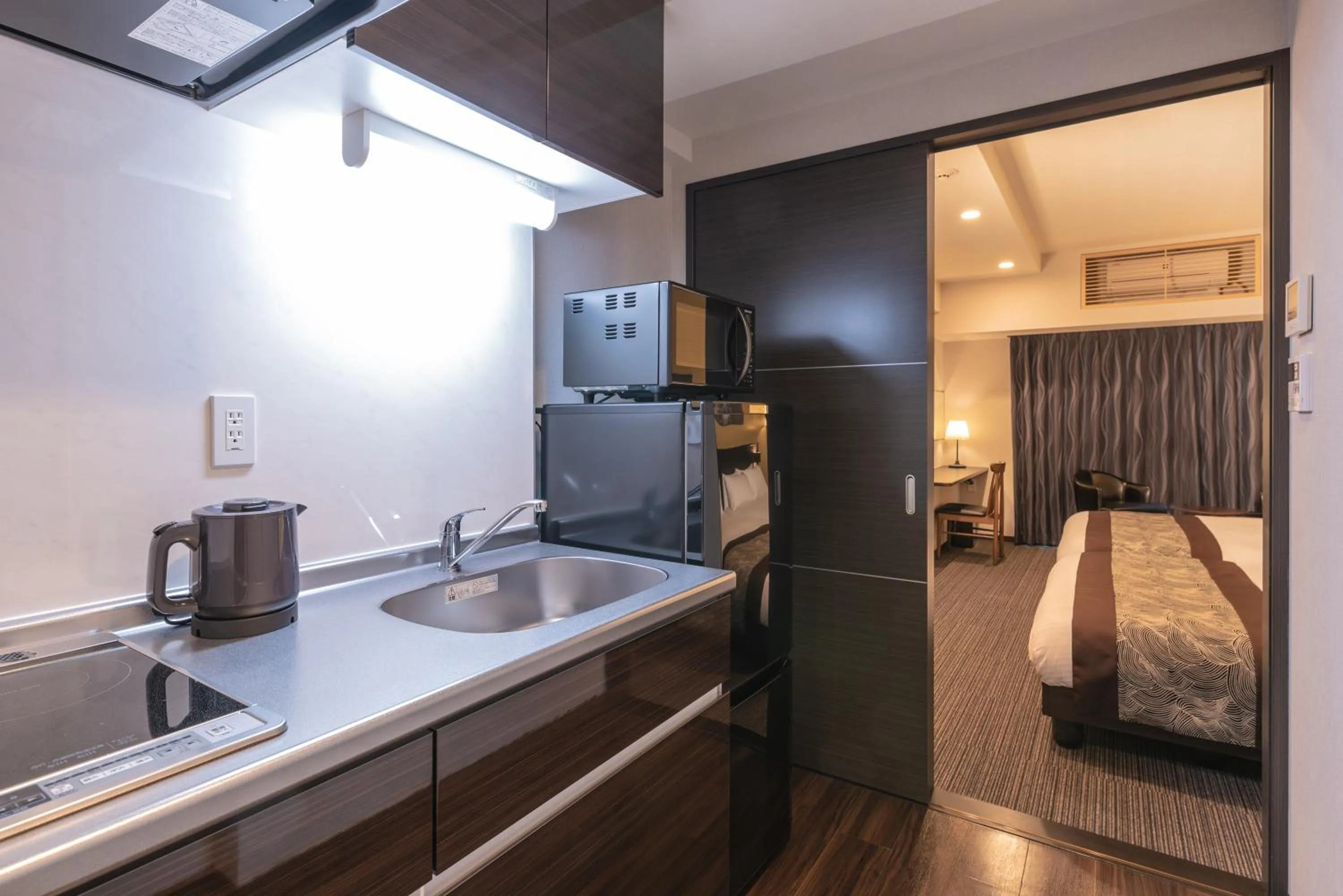 Kitchen or kitchenette, Bed in Zen Kyoto Apartment Hotel