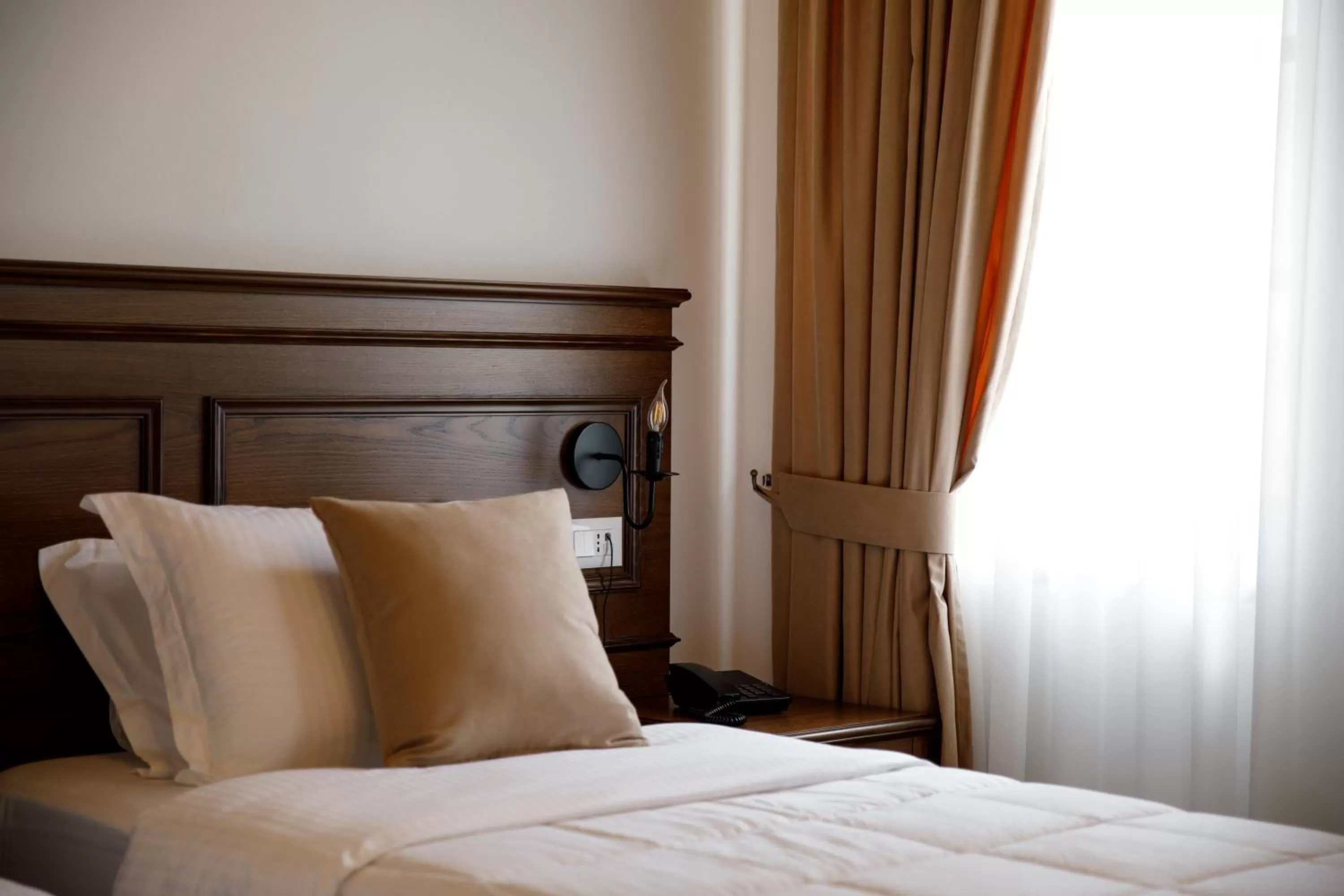 Bed in Rose Garden Hotel