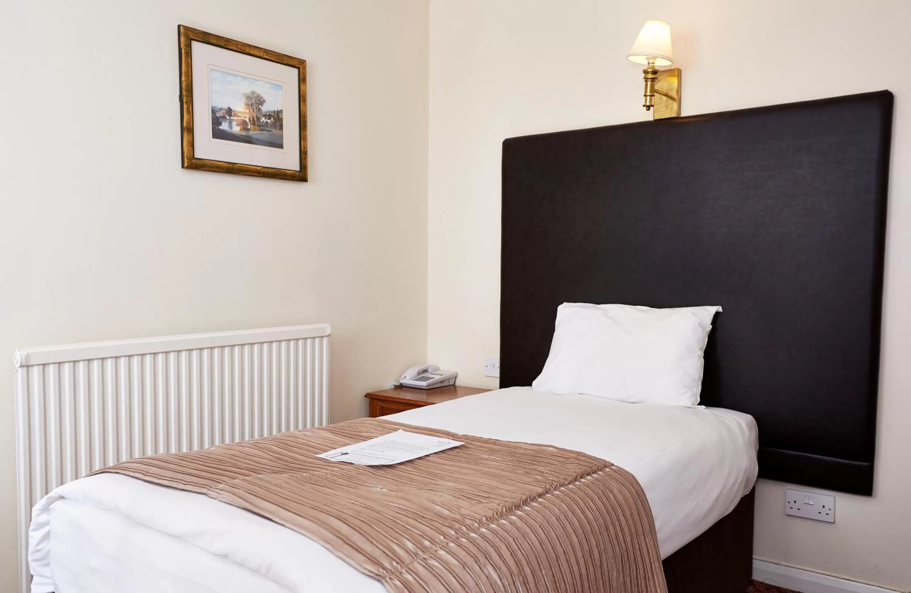 Bed in Raven Hotel by Greene King Inns