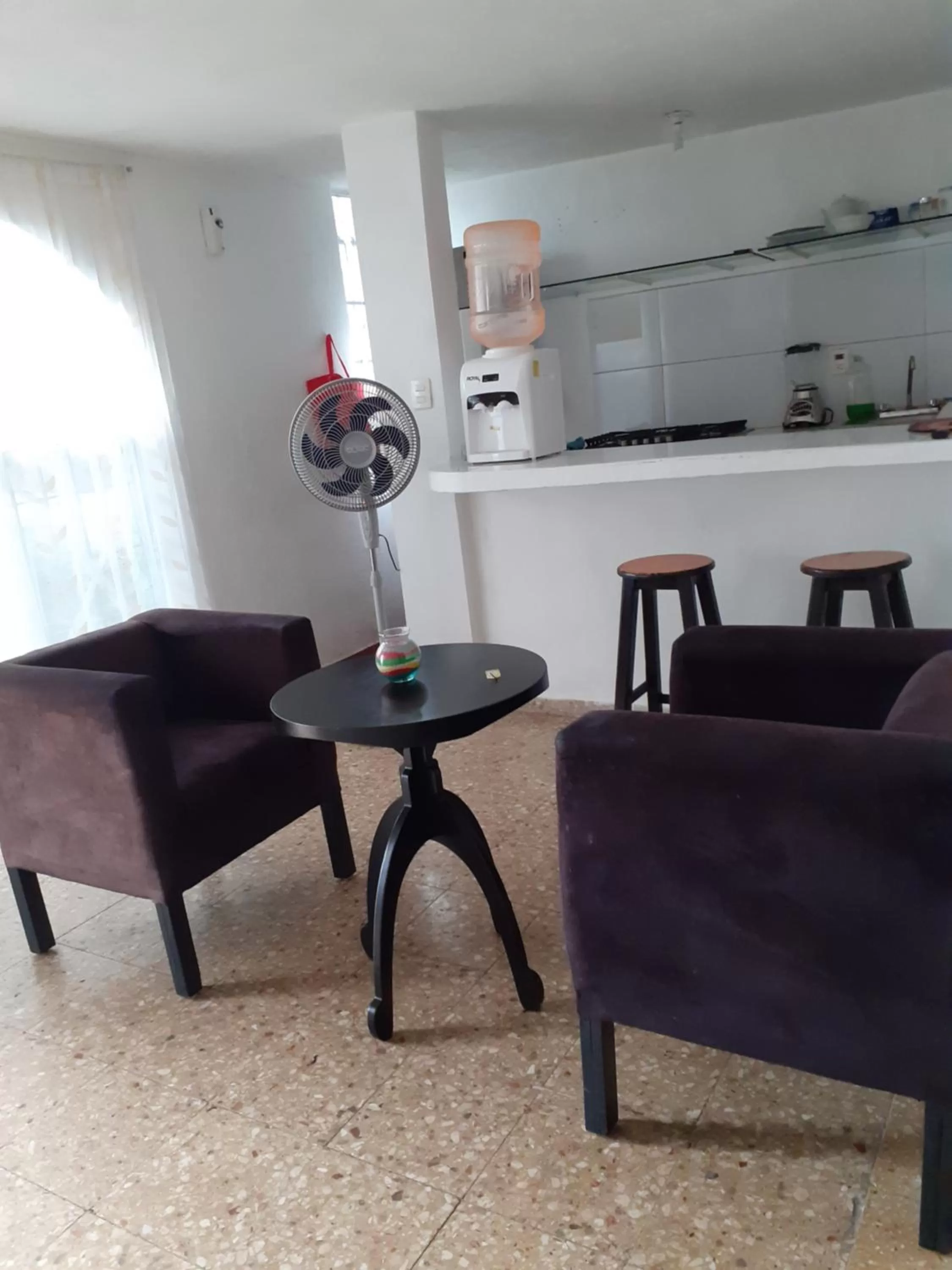 Communal lounge/ TV room in Thelmar Rooms Cancun