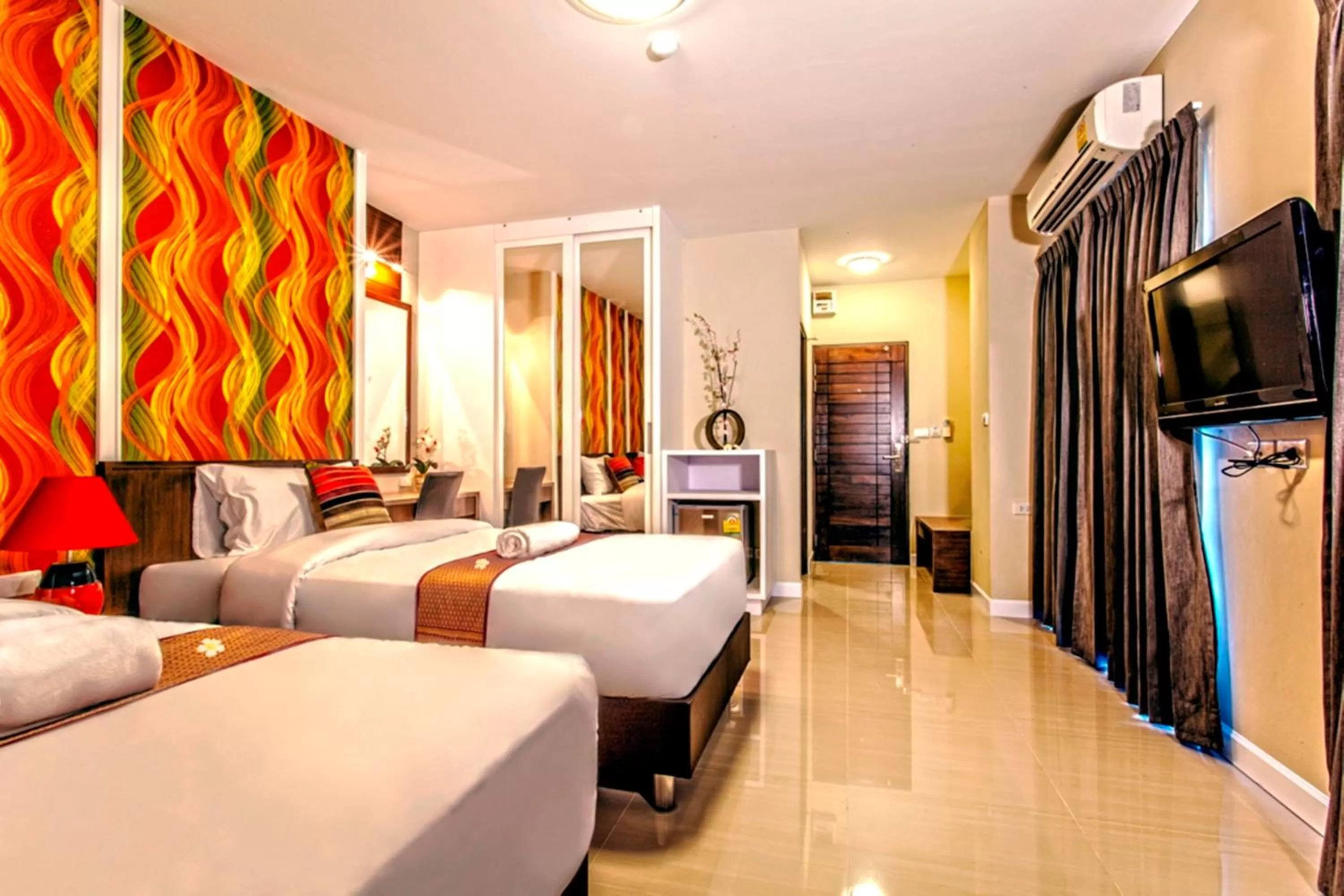 TV and multimedia, Bed in The Aim Sathorn Hotel